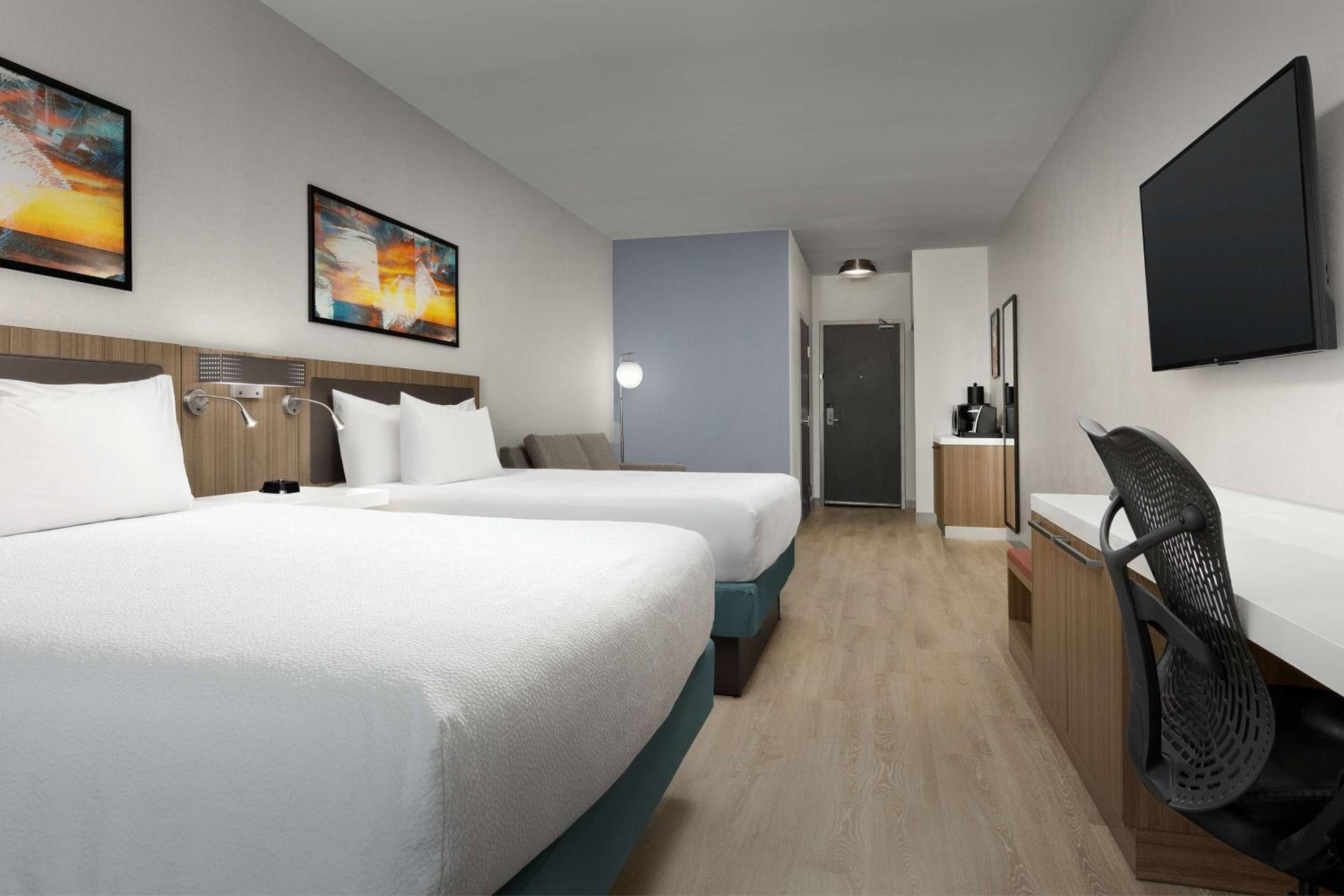 Queen Room with Two Queen Beds and Sofa Bed - Photo 1