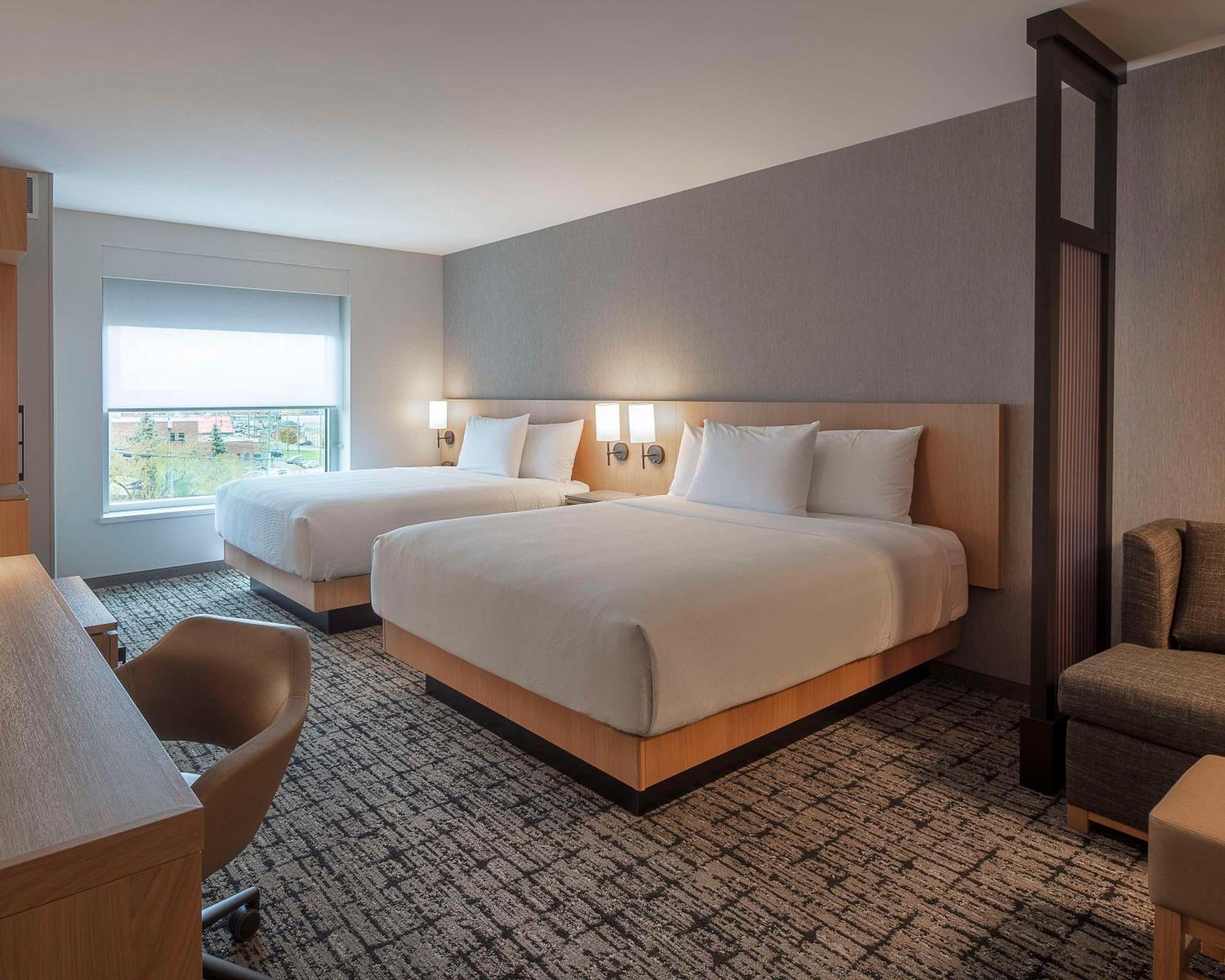 Standard Queen Room with Two Queen Beds and Sofa Bed - Photo 1
