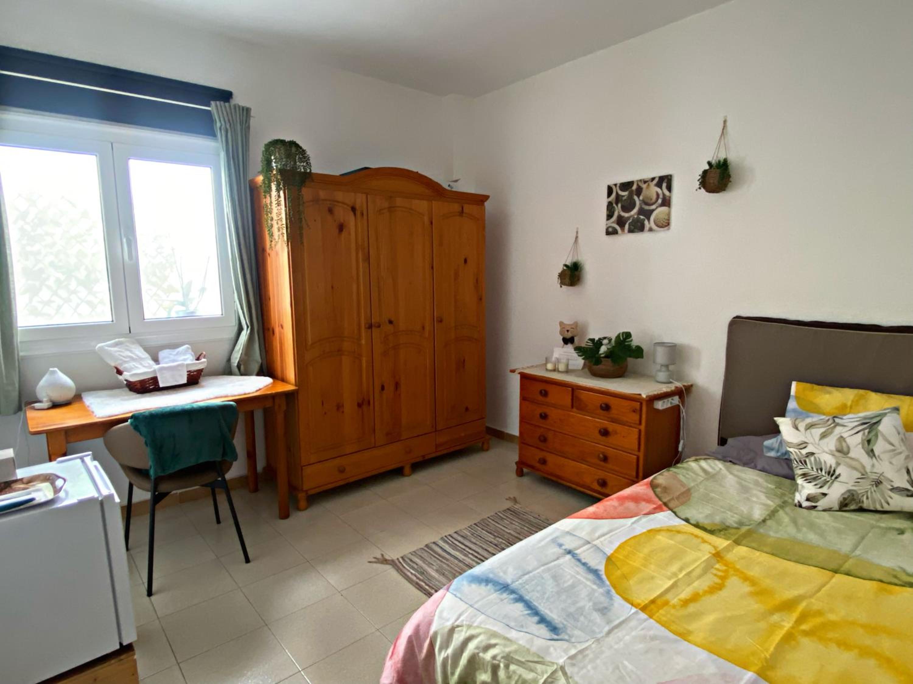 Habitación individual con baño compartido