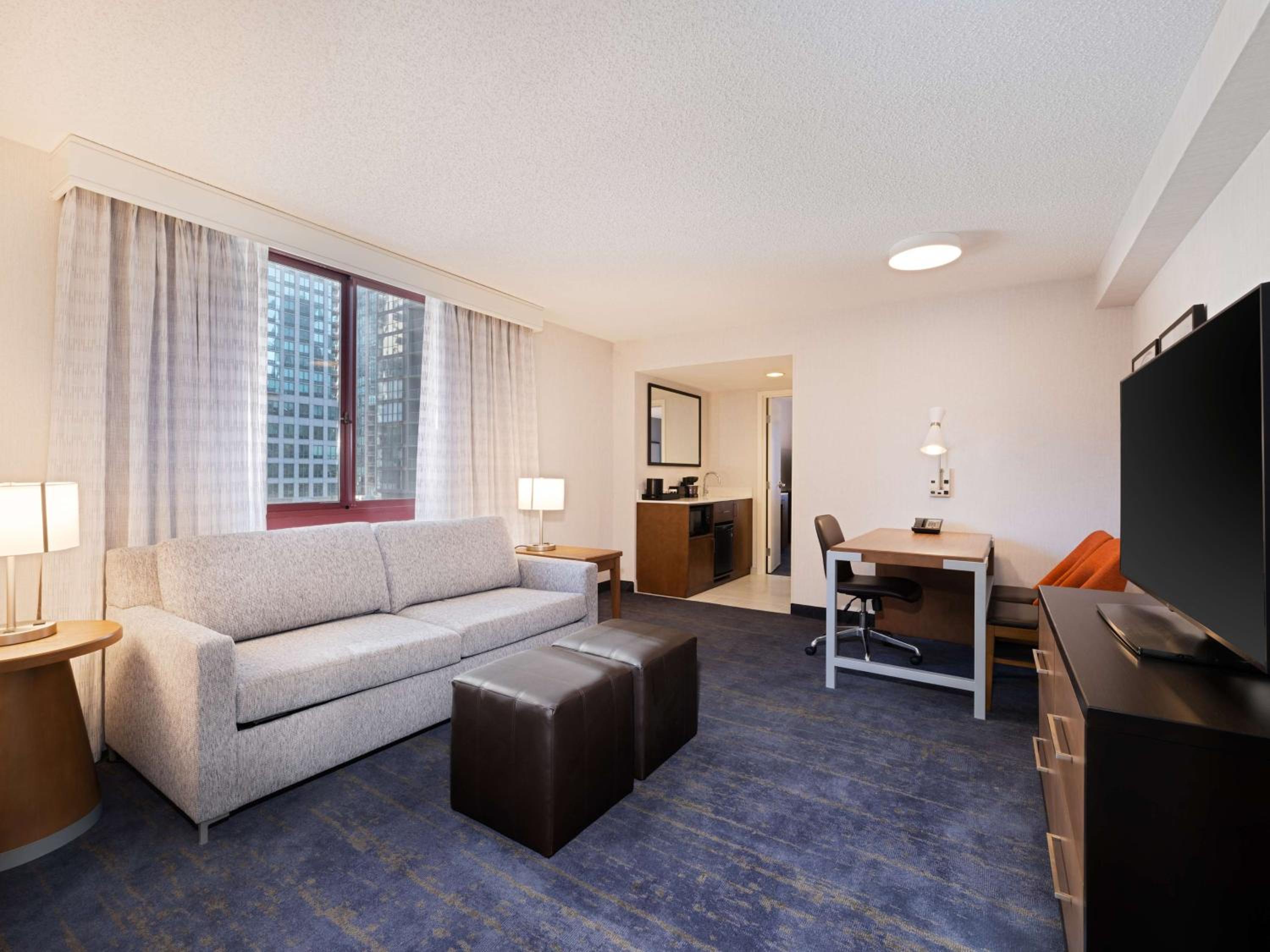 Two Room Corner Suite with Two Double Beds and Sofa bed