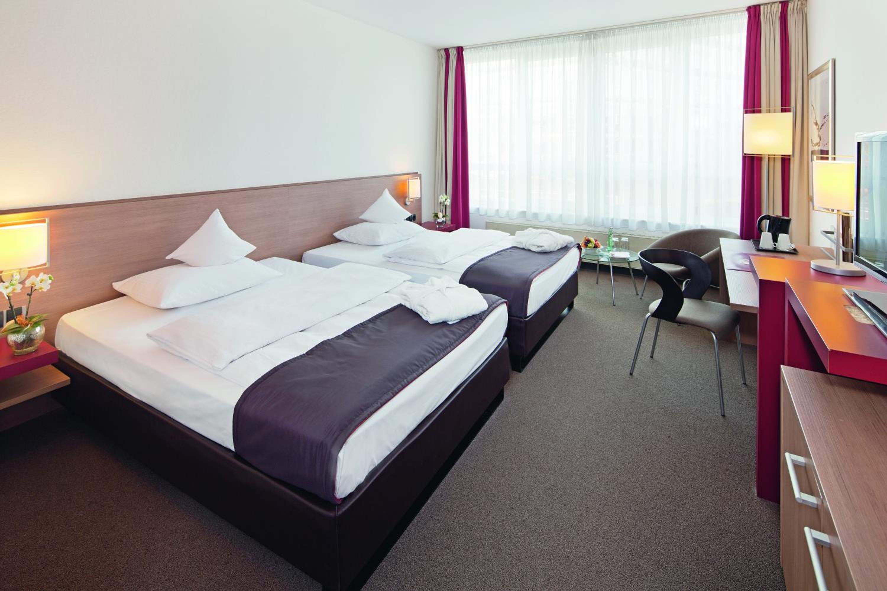 Premium Queen Room with Two Queen Beds - Photo 1