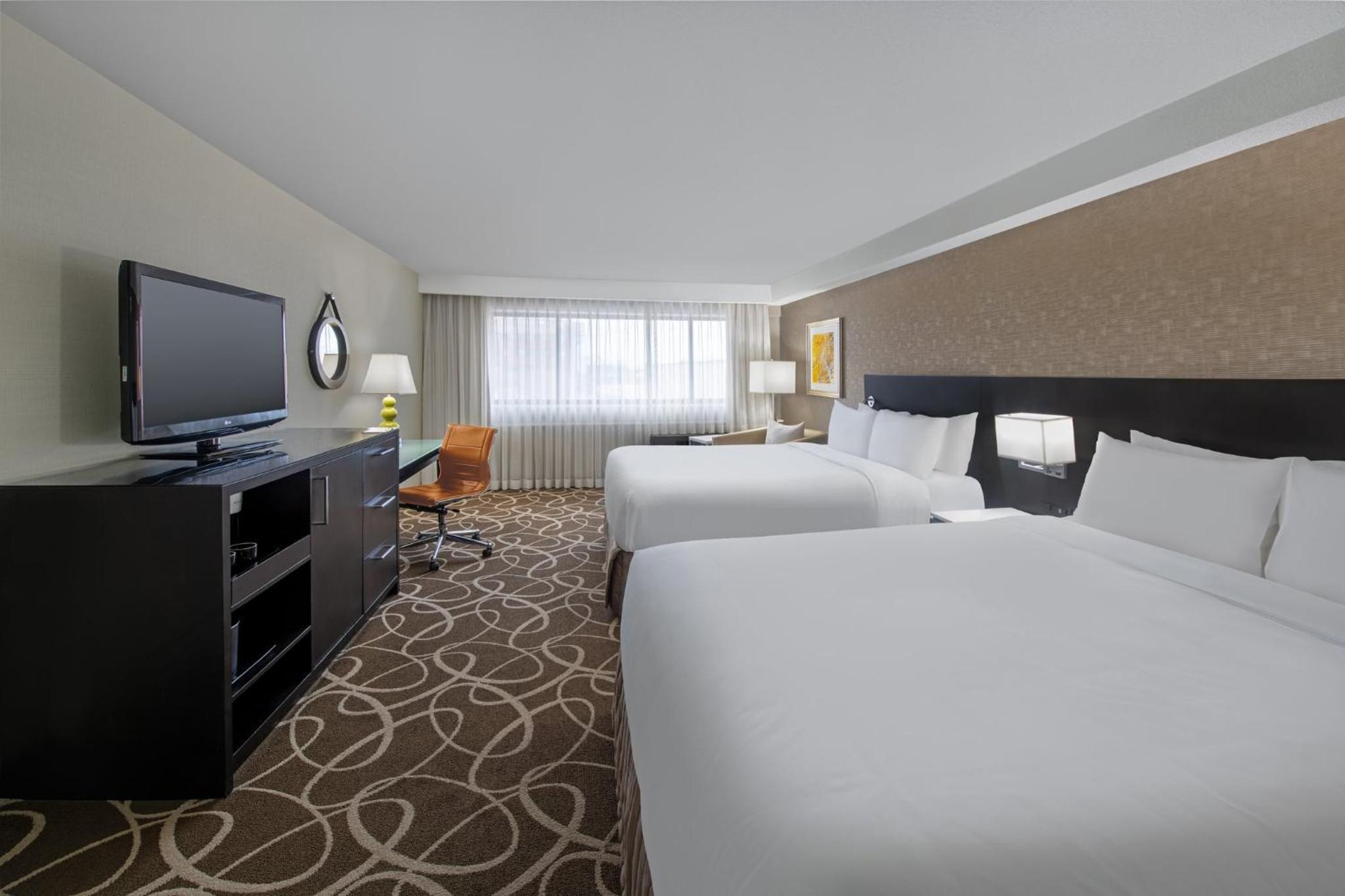 Premium Queen Room with Two Queen Beds - Photo 1