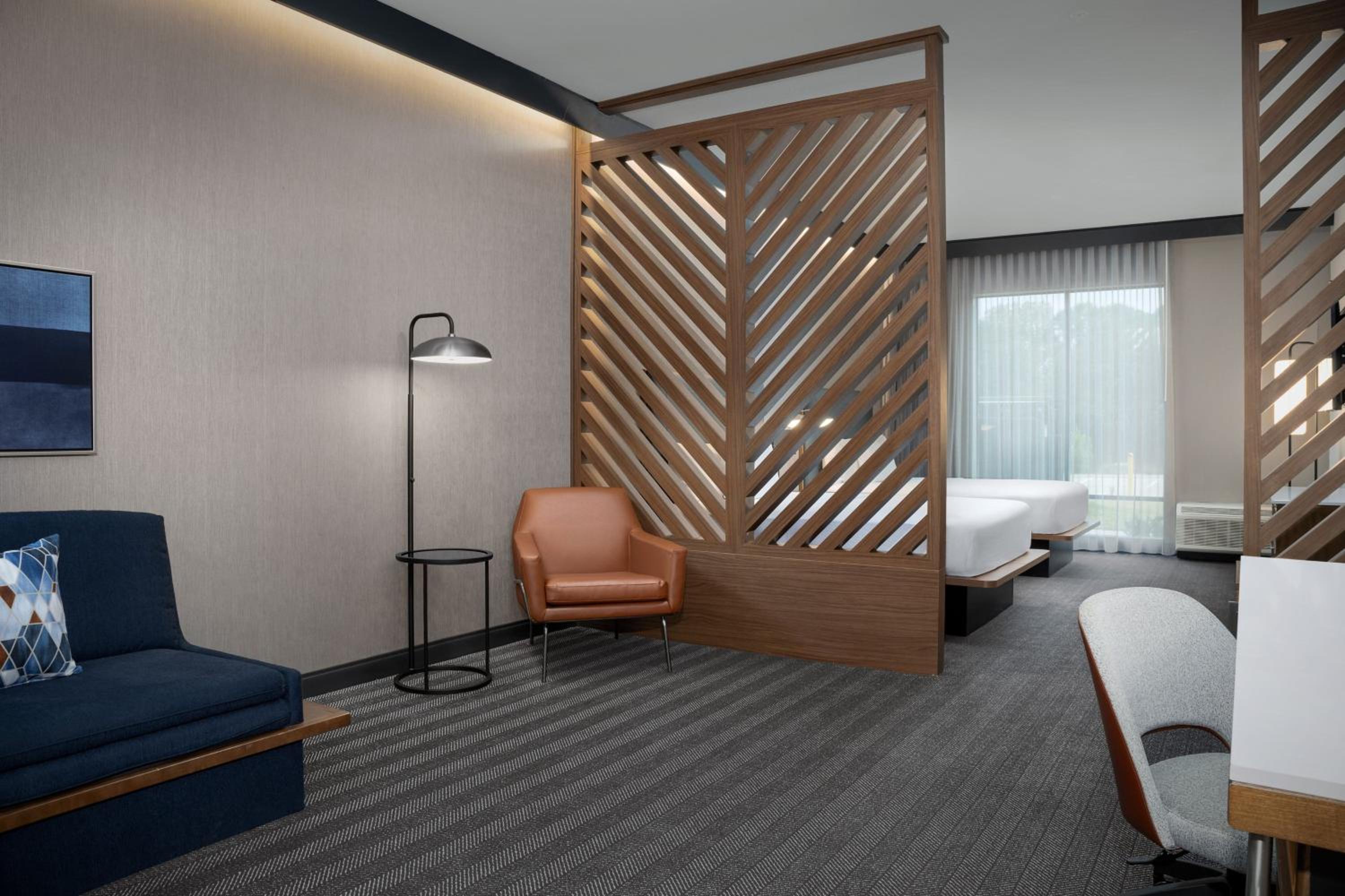 Queen Suite with Two Queen Beds and Sofa Bed - Photo 1