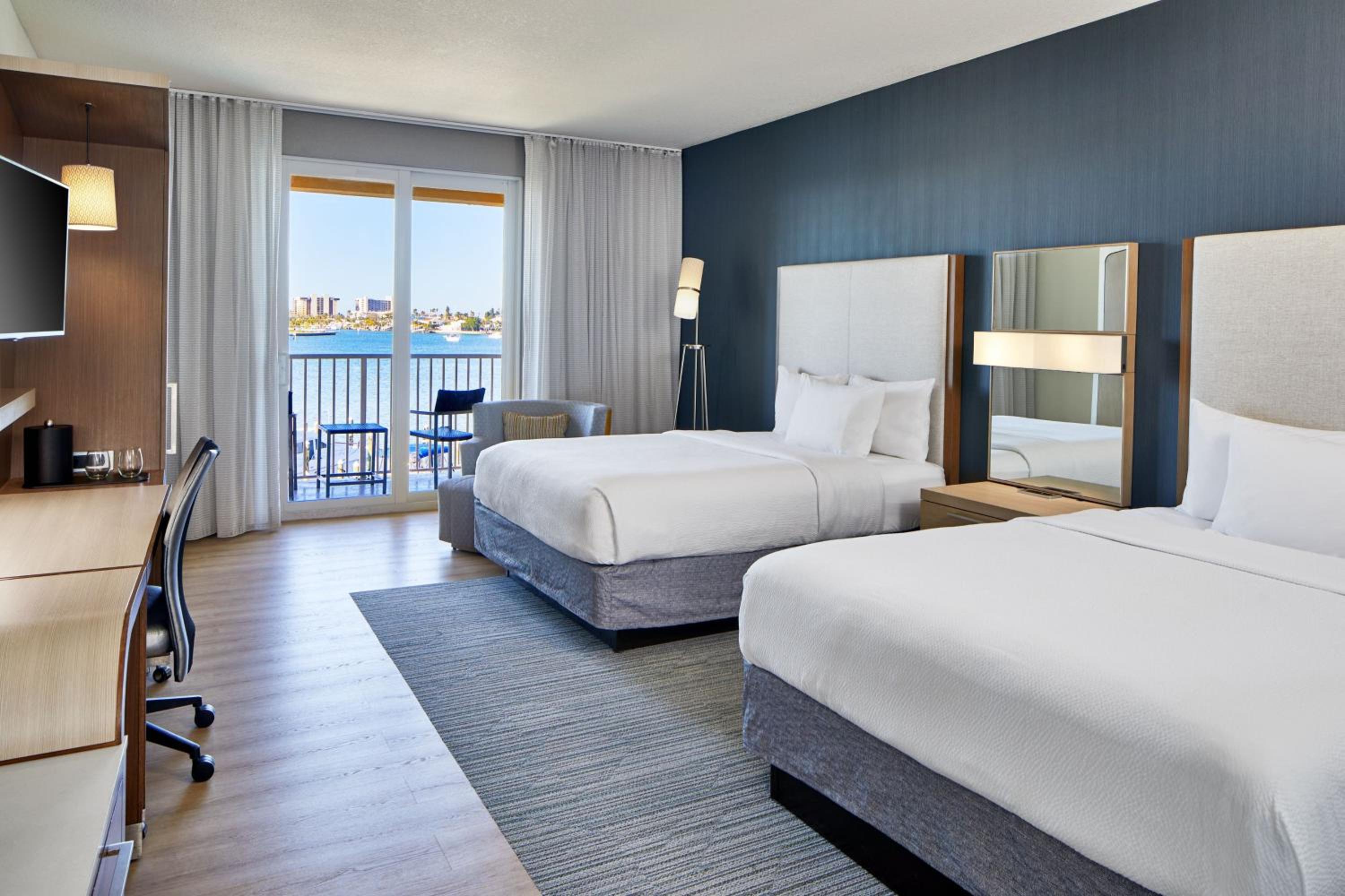 Queen Room with Two Queen beds and Pool and Water View