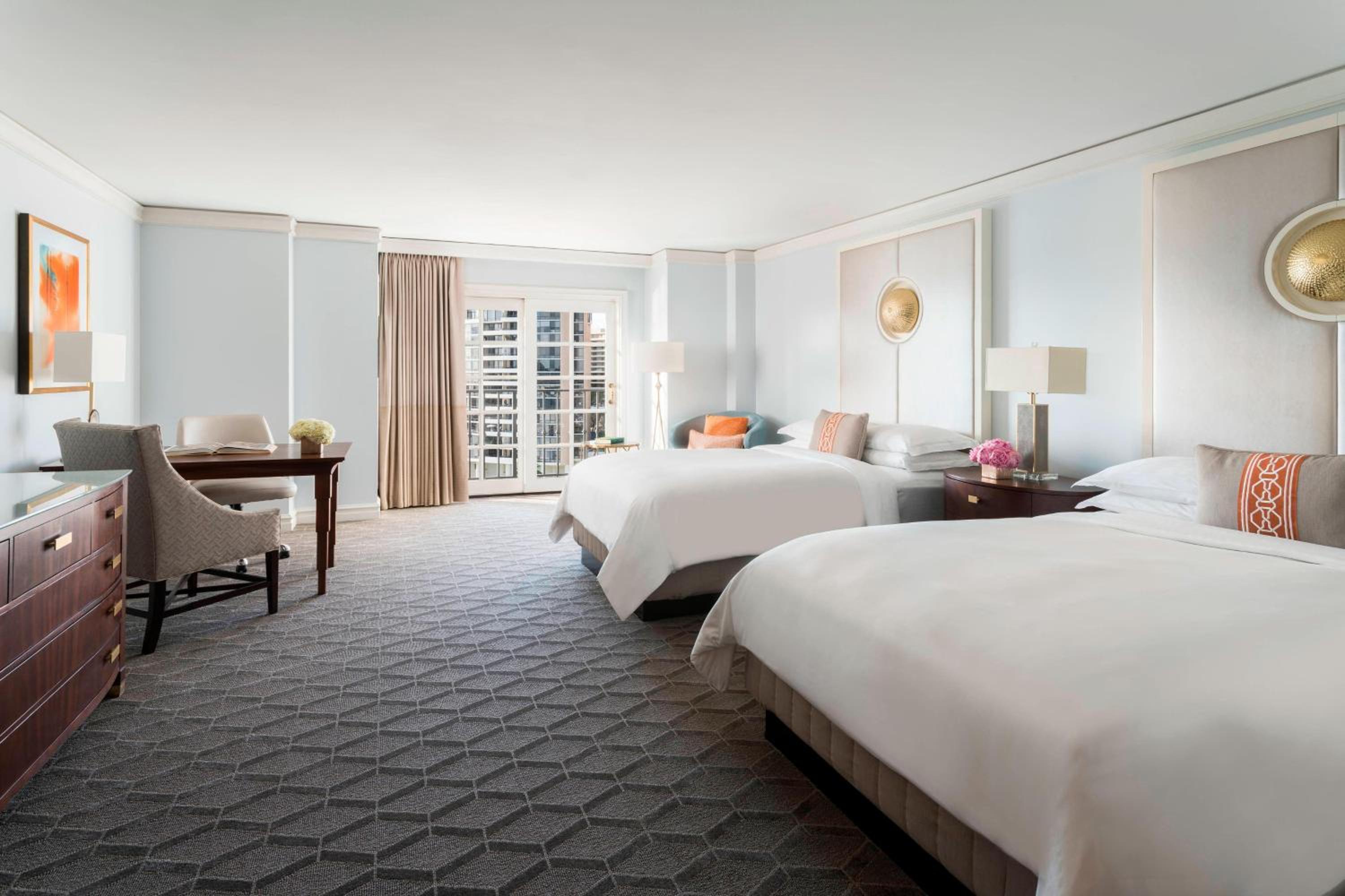 Large Room with Two double Beds and Partial Water View