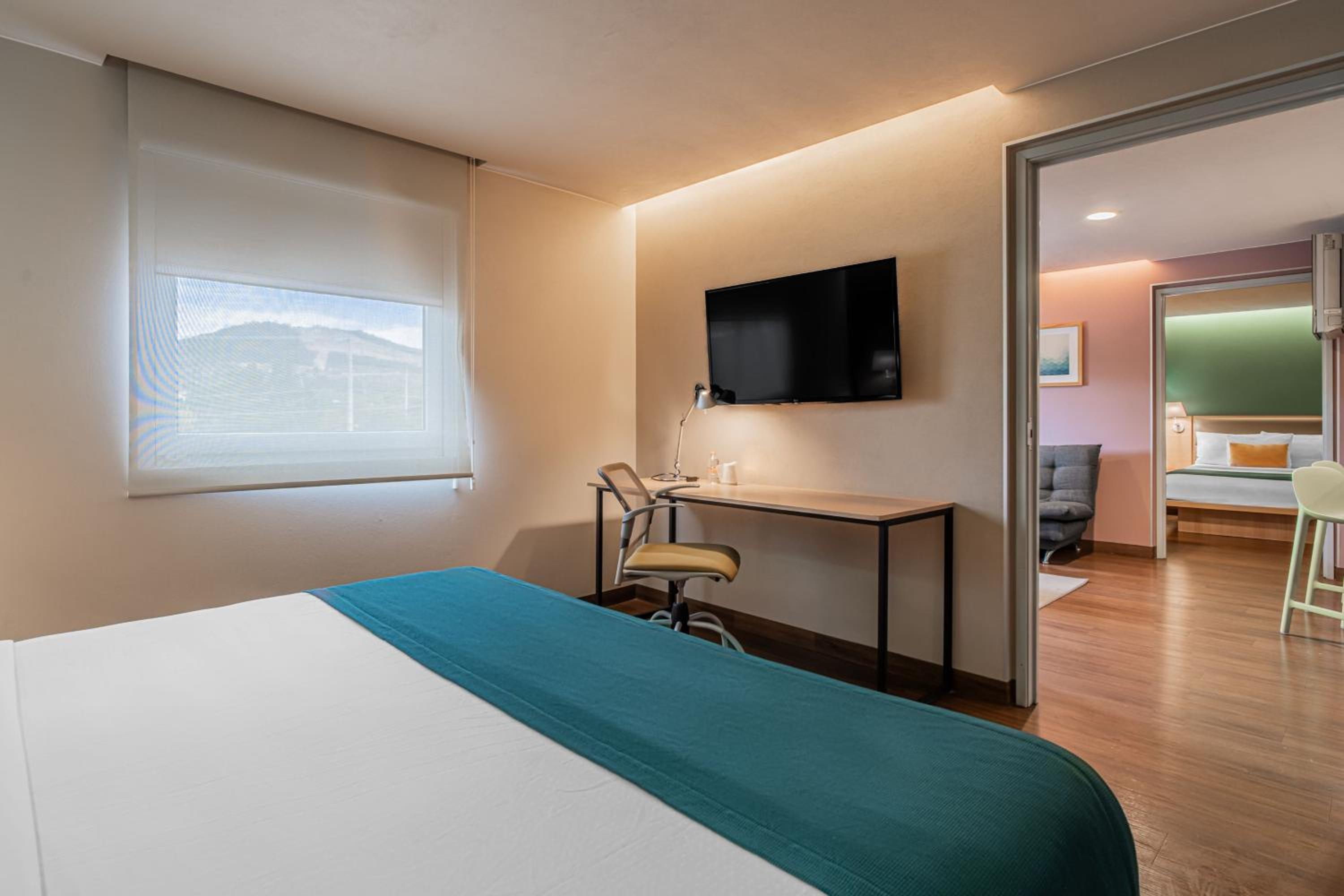 Two-Bedroom Suite with One King and Two Double Beds with Sofa Bed and Kitchenette - Photo 3