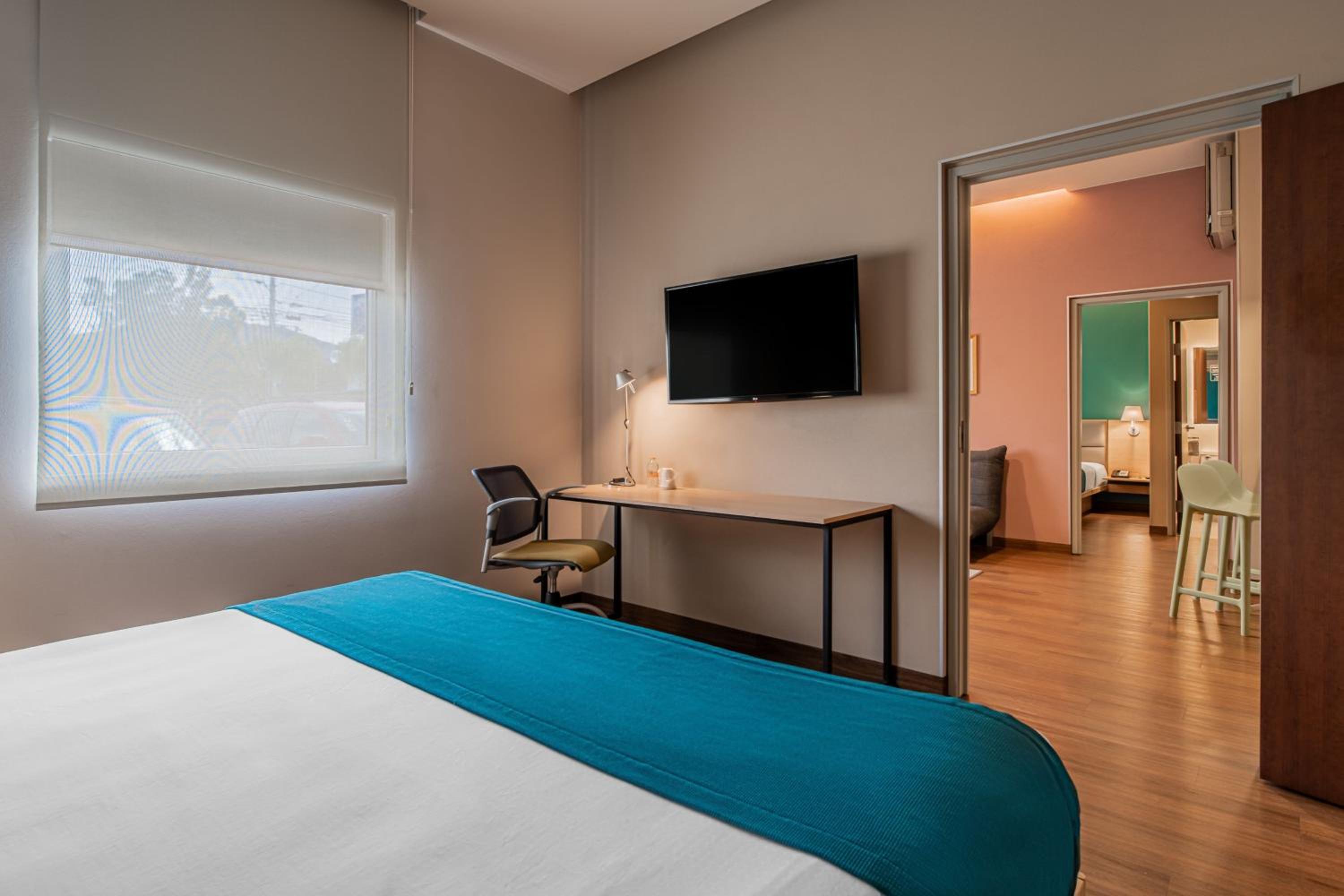 Two-Bedroom Suite with One King and Two Double Beds with Sofa Bed and Kitchenette - Photo 4