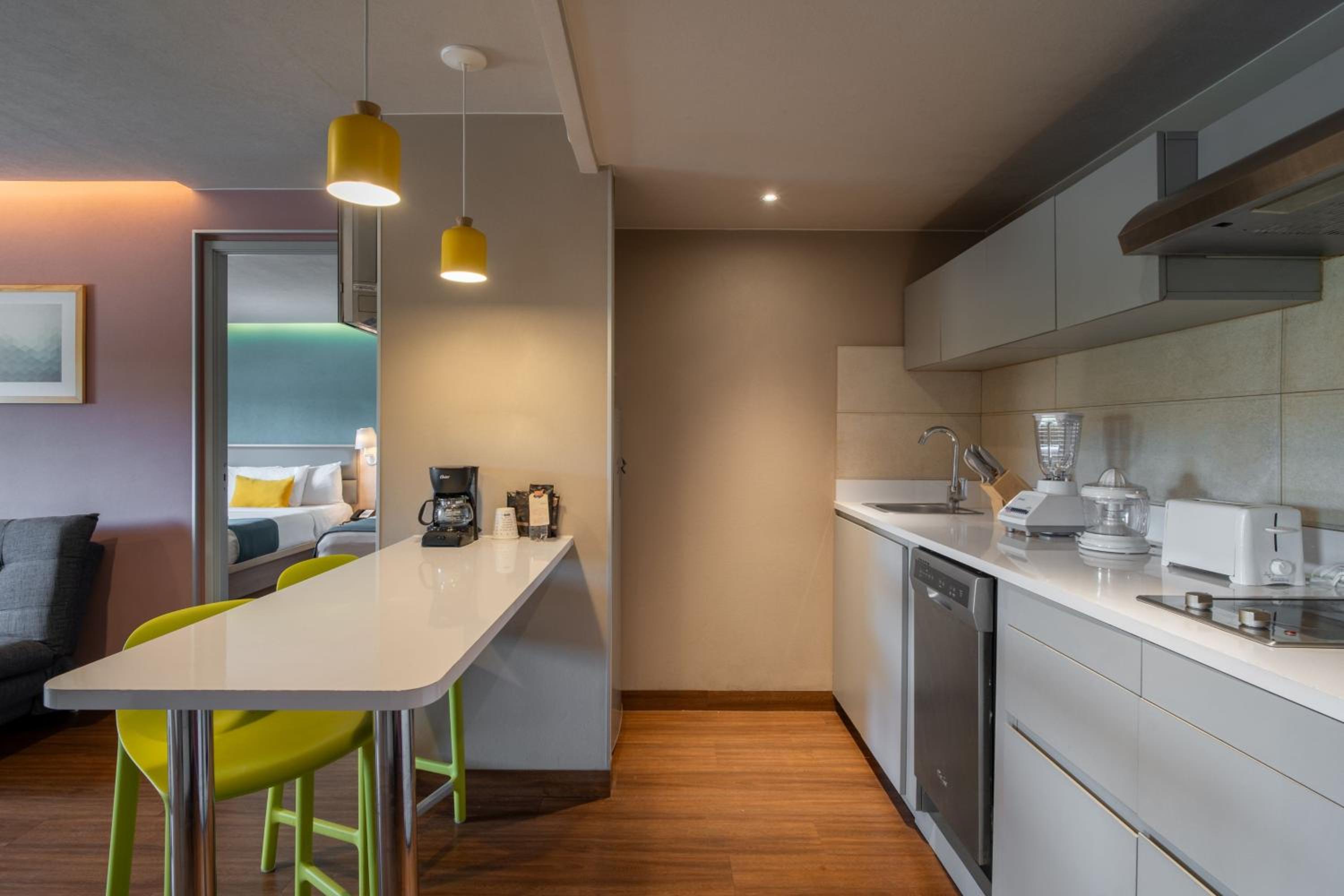 Two-Bedroom Suite with One King and Two Double Beds with Sofa Bed and Kitchenette - Photo 7
