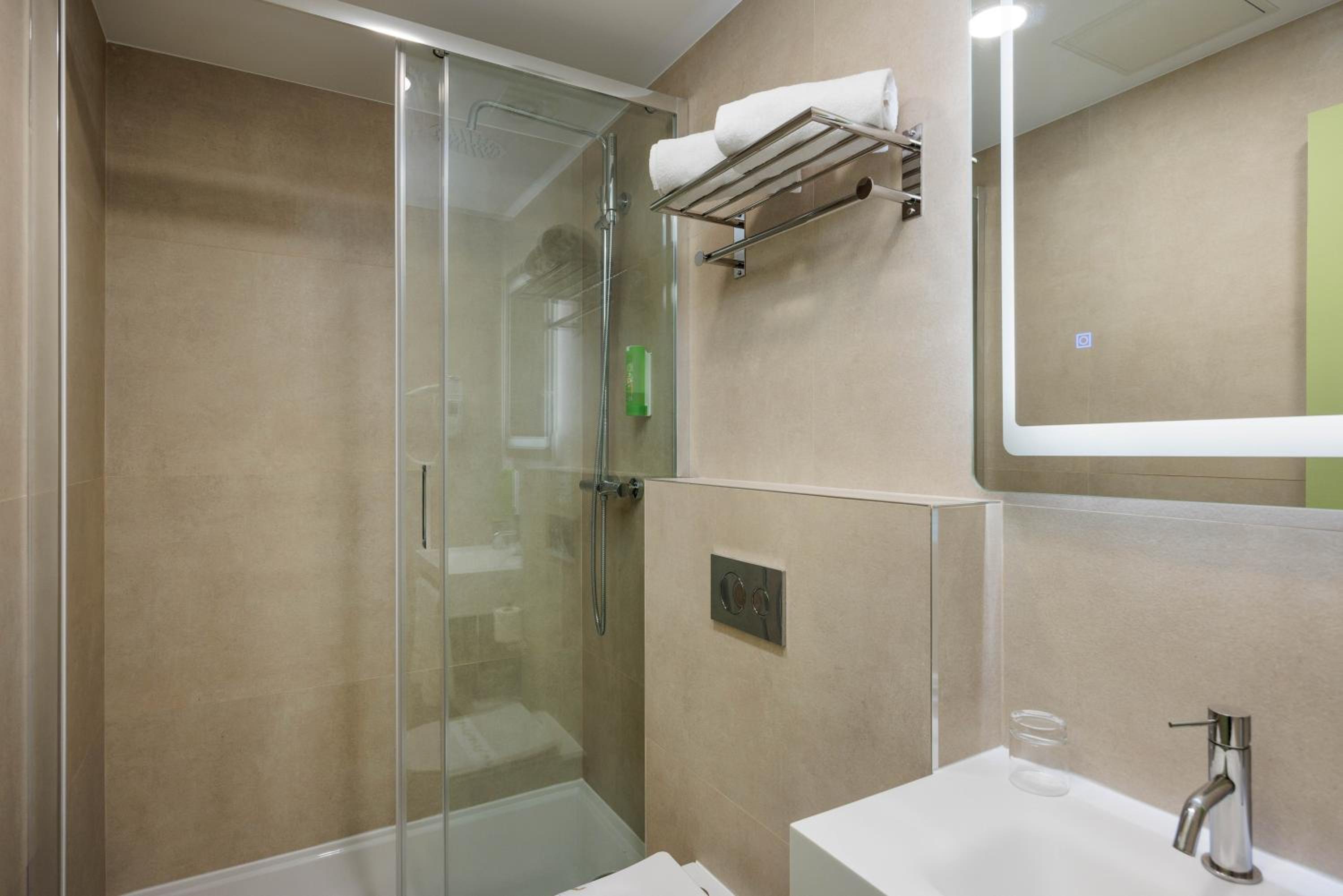 Relax in this modern, refreshing bathroom space.