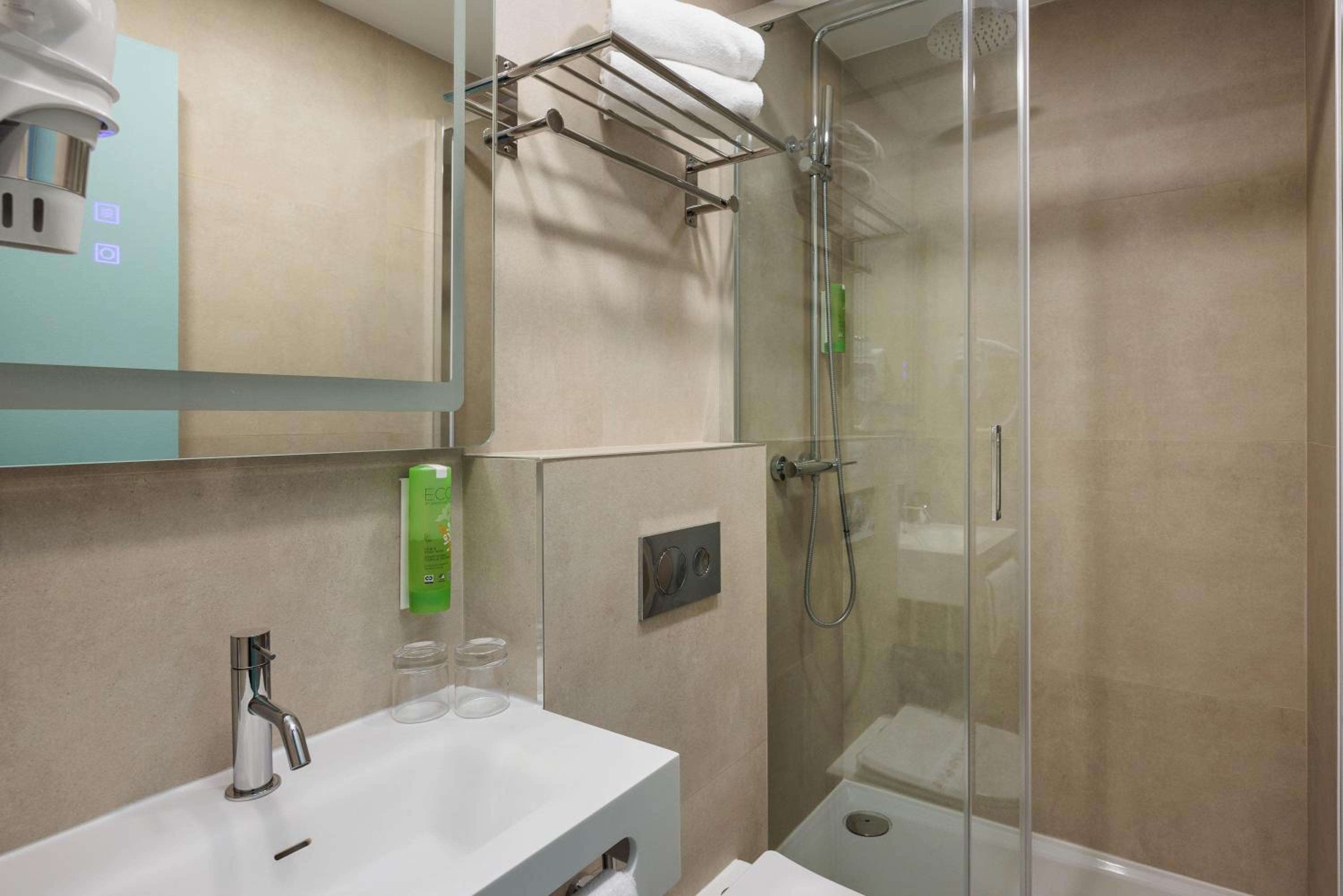 Refresh and unwind in our modern bathroom oasis.