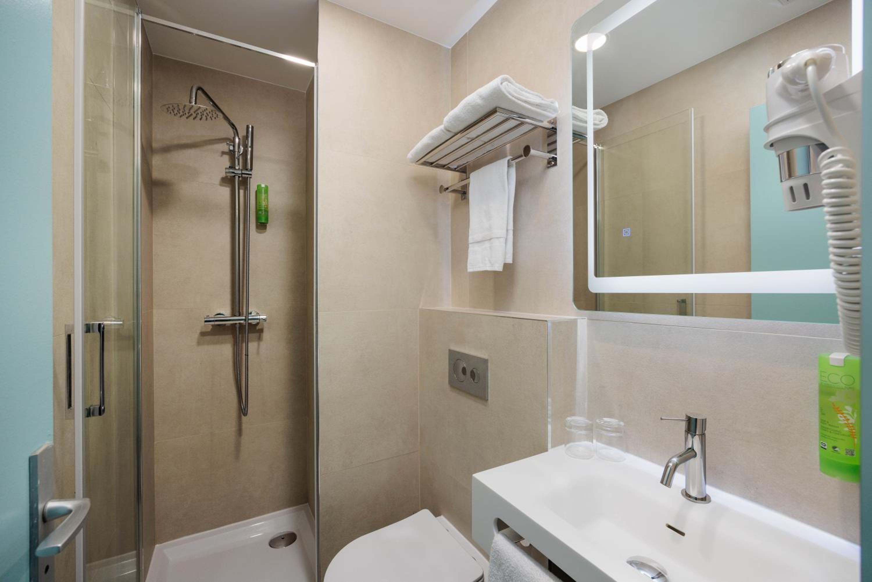 Relax in our modern, sleek bathroom oasis.