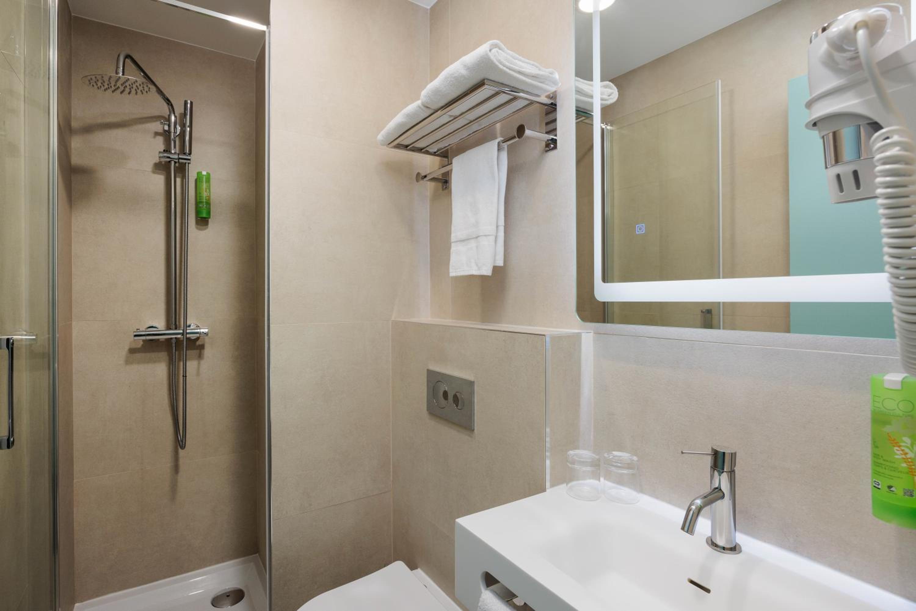 Relax in this sleek, modern bathroom oasis.