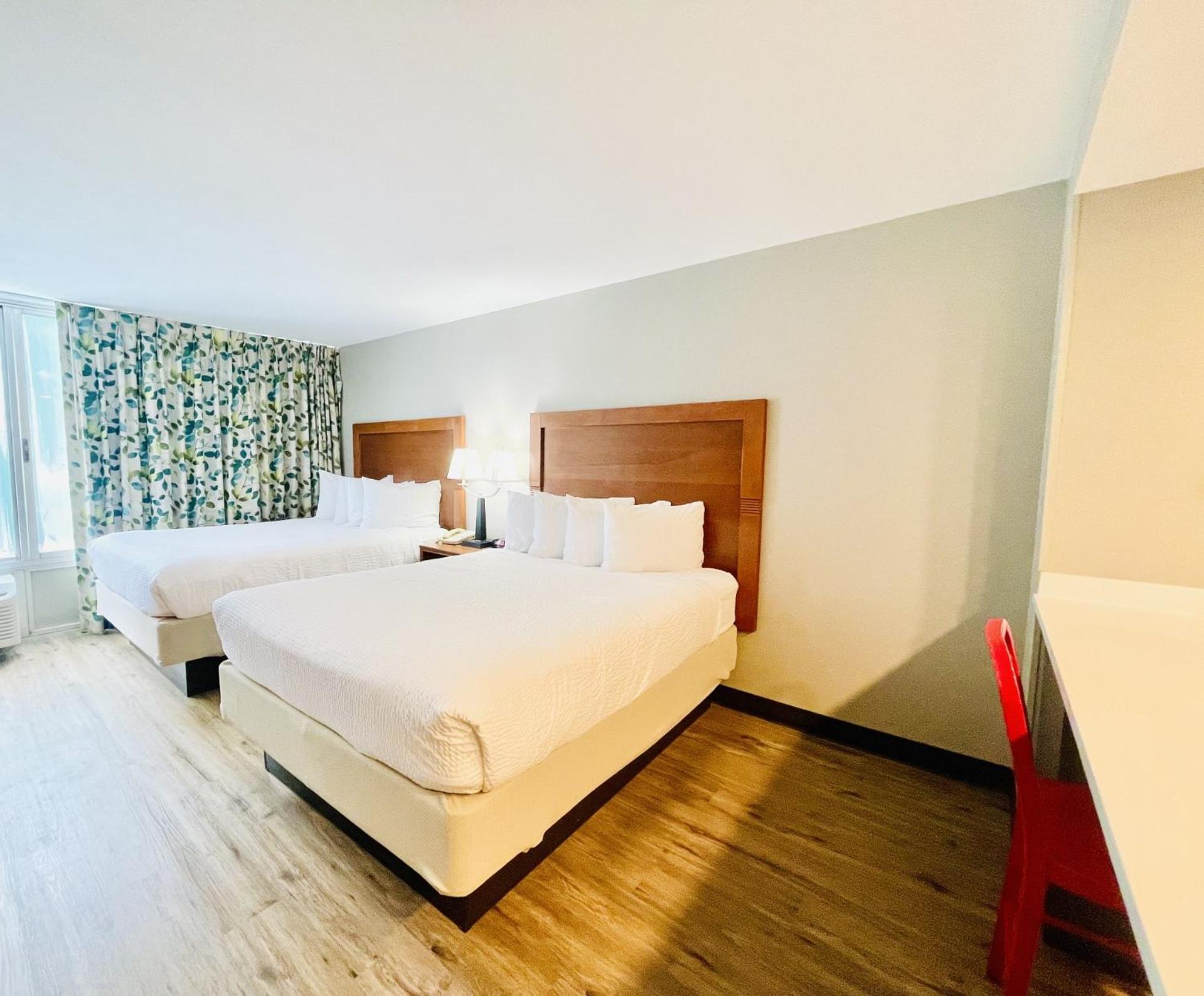 Queen Room with Two Queen Beds and Kitchenette - Non-Smoking - Photo 1
