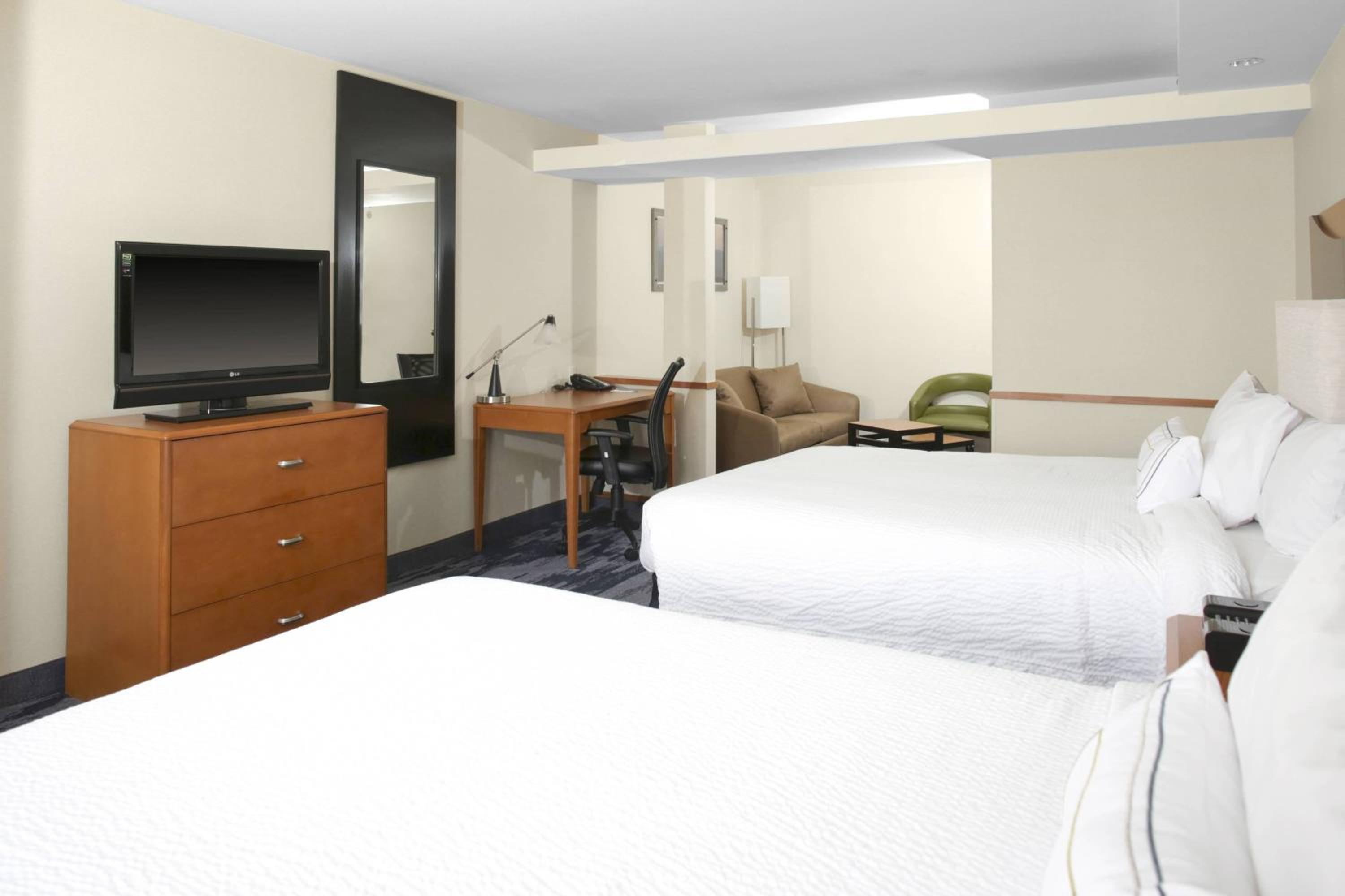 Queen Suite with Two Queen Beds and Sofa Bed - Photo 1