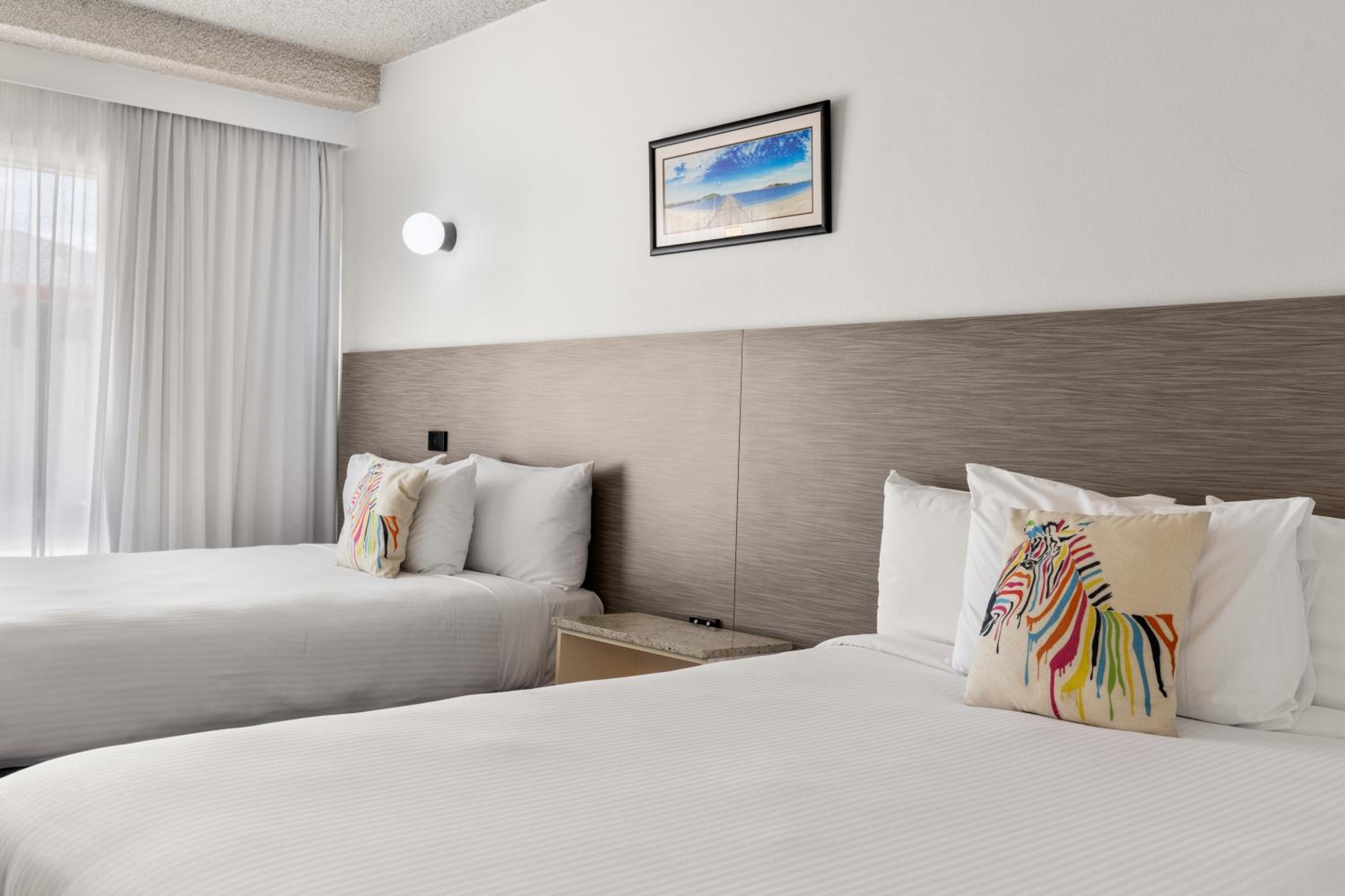 Deluxe Twin with 2 Queen Beds - Not Pet Friendly - Photo 1
