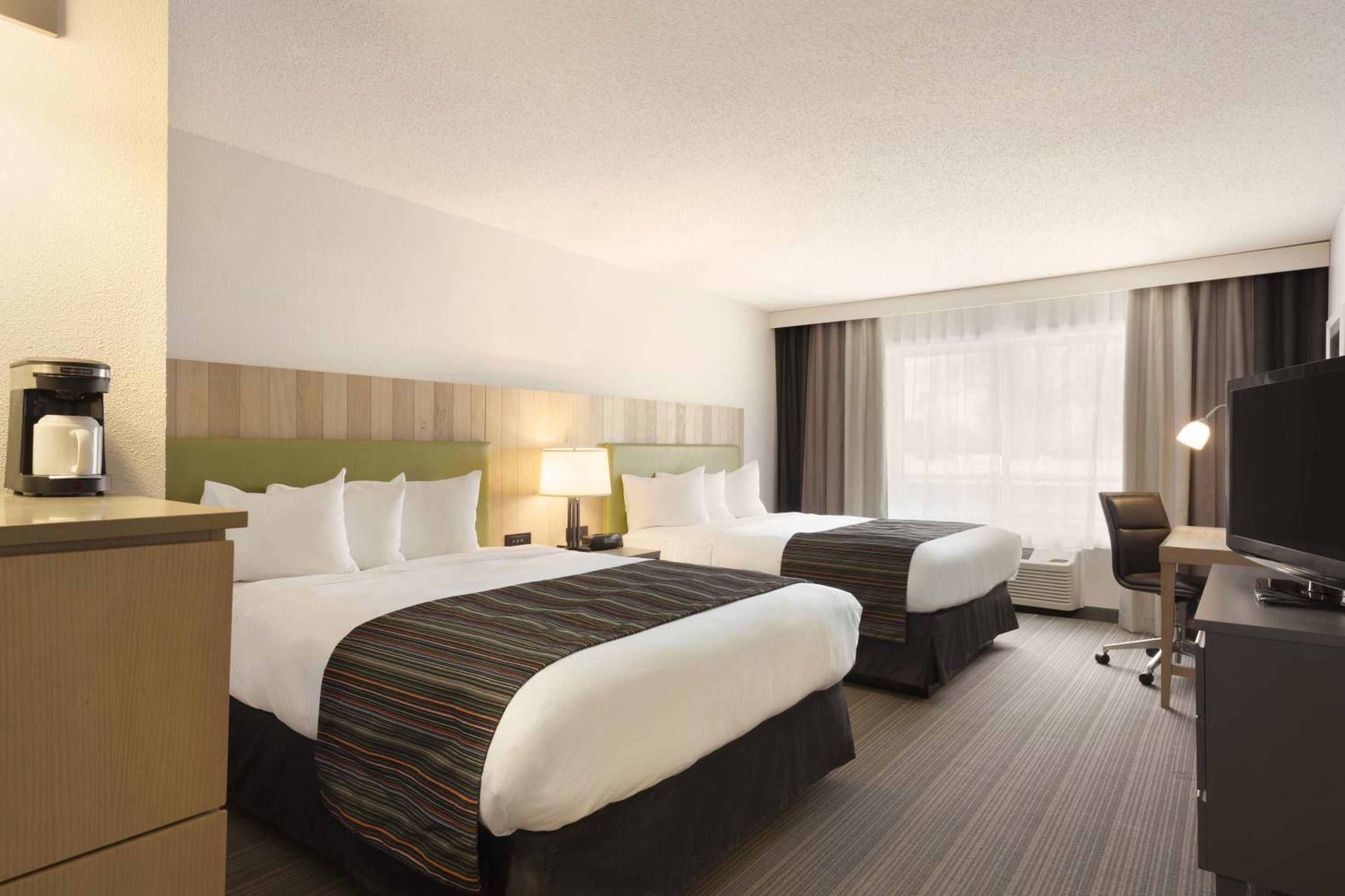 Queen Room with Two Queen Beds - Photo 1