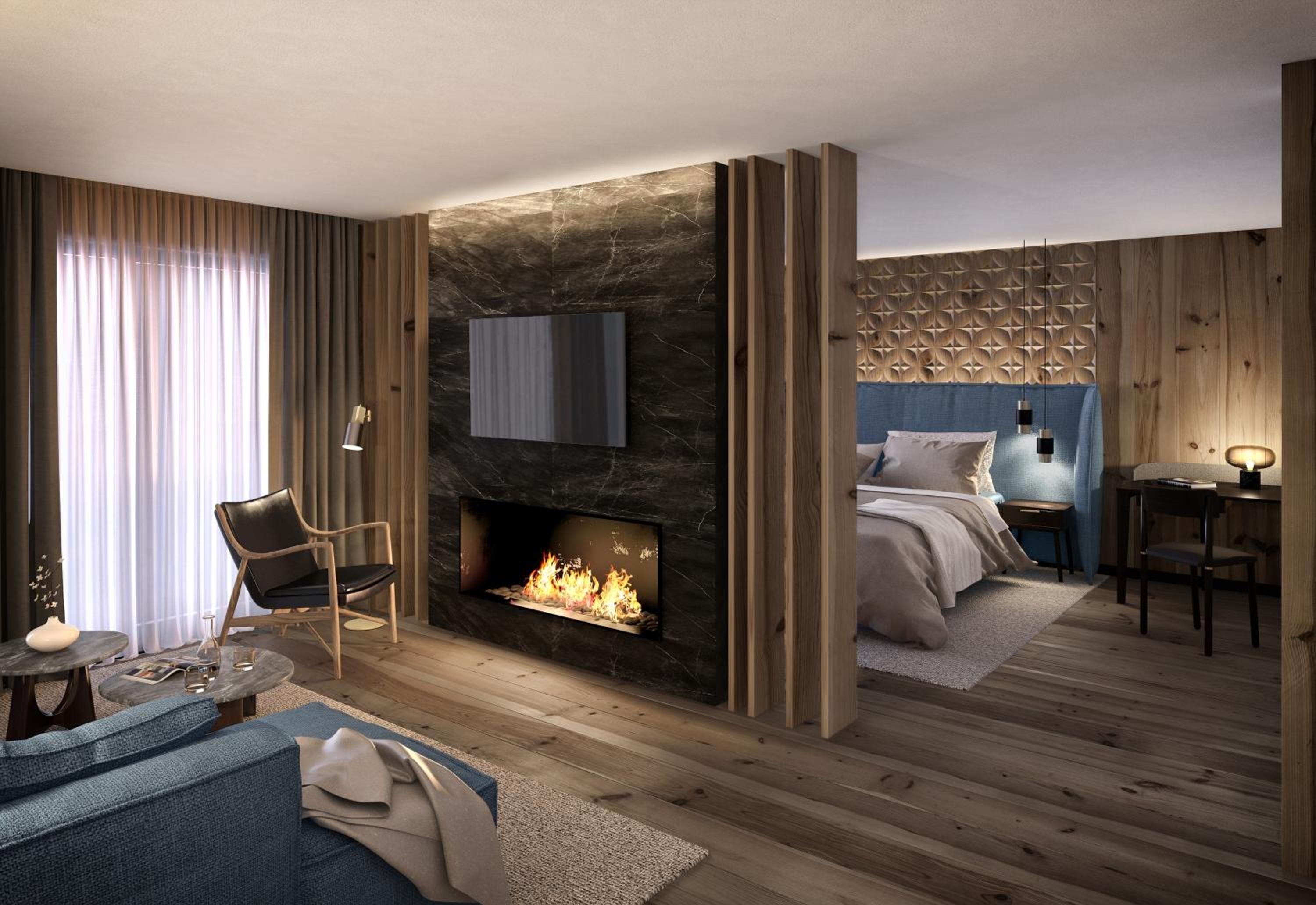 bedroom with a fireplace in the middle of the room