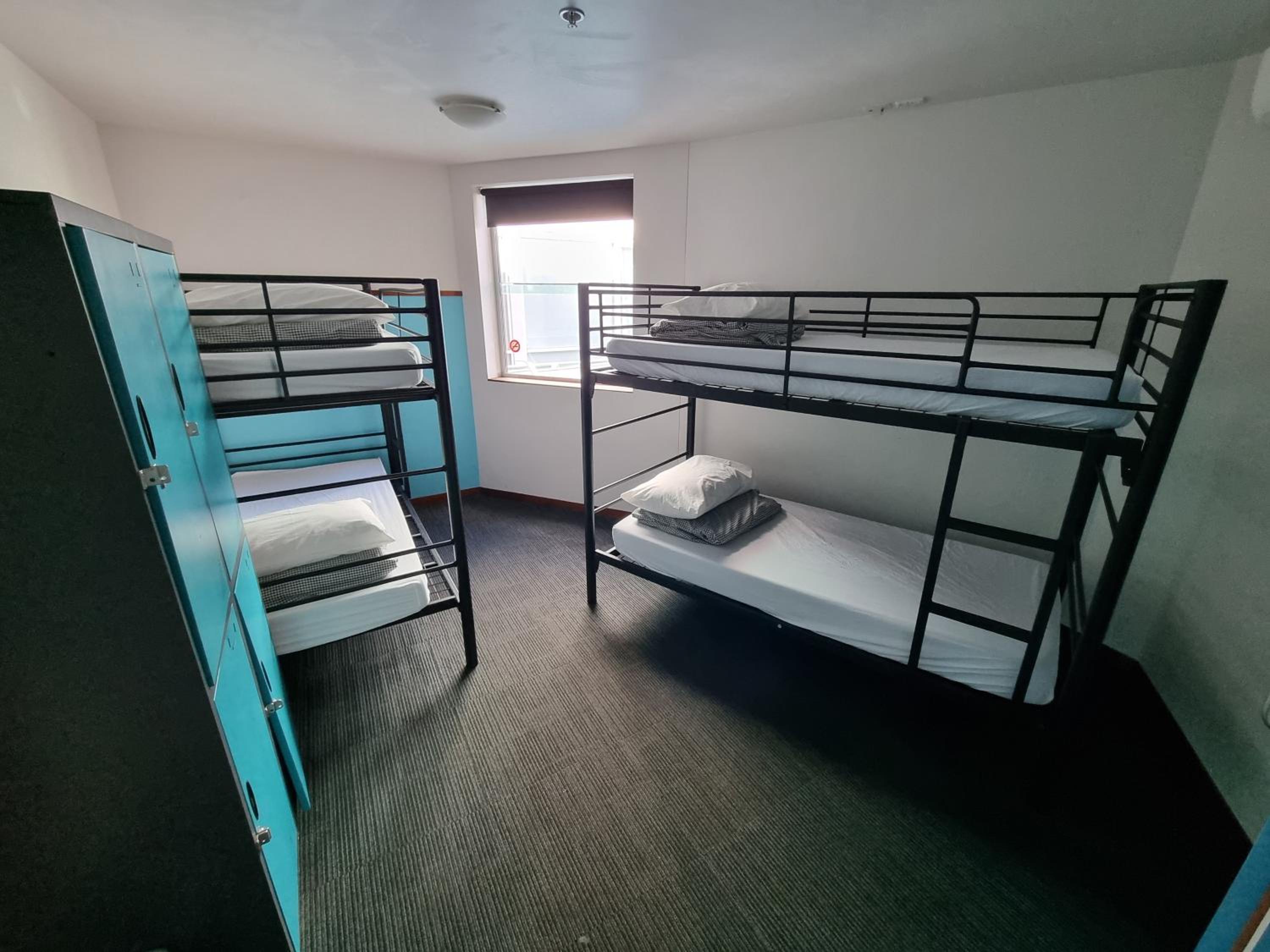 Bed in 4-Bed Mixed Dormitory Room with Private Bathroom photo 1