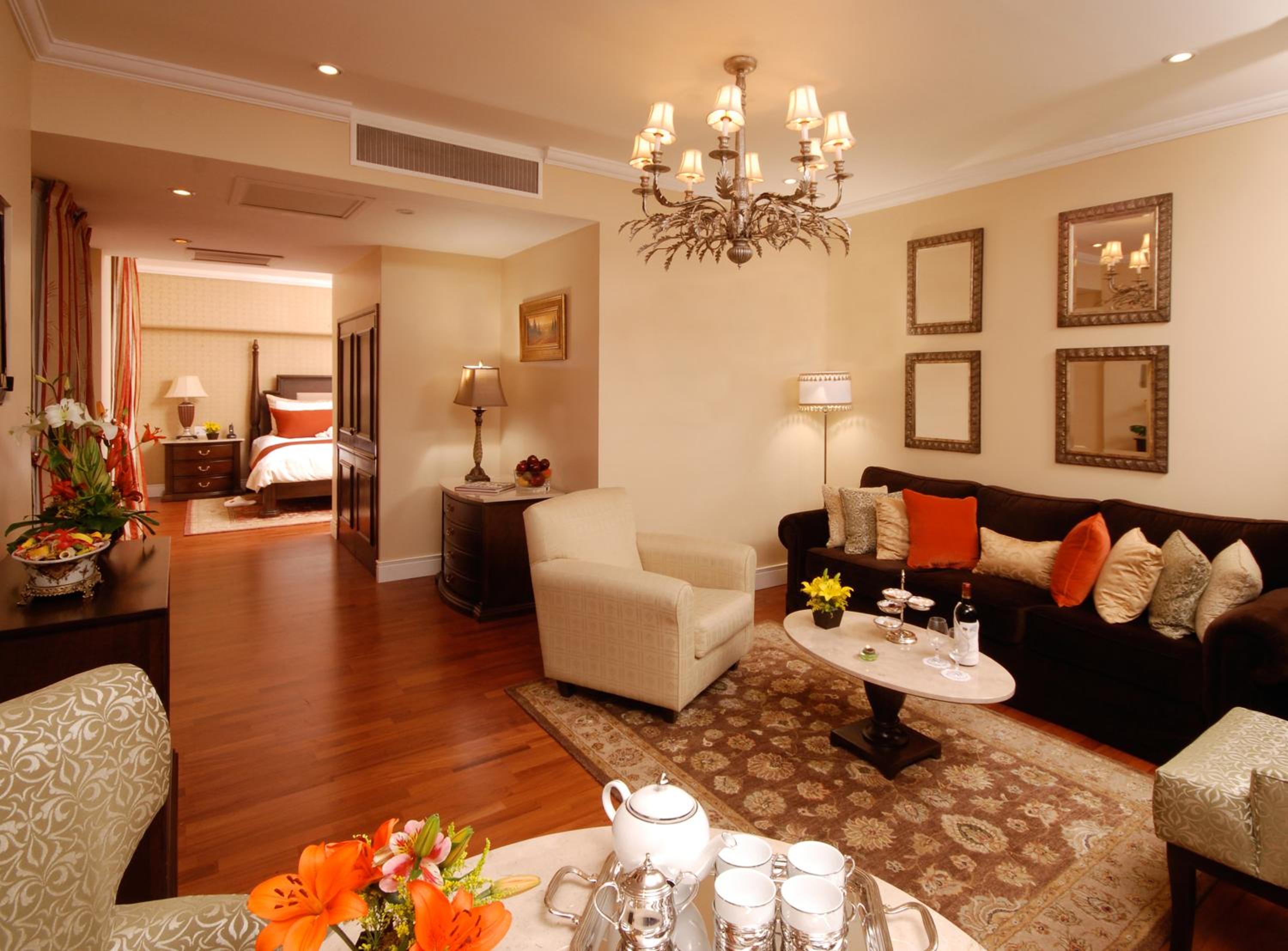 Experience luxury in a spacious, inviting hotel room.