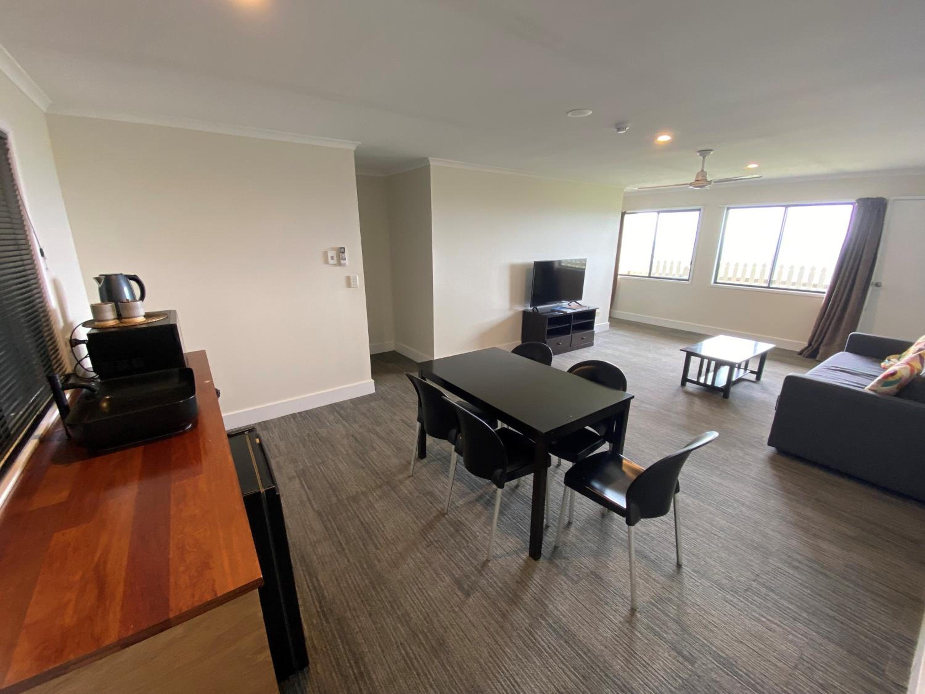 Two-Bedroom Unit with living area and stairs photo 1