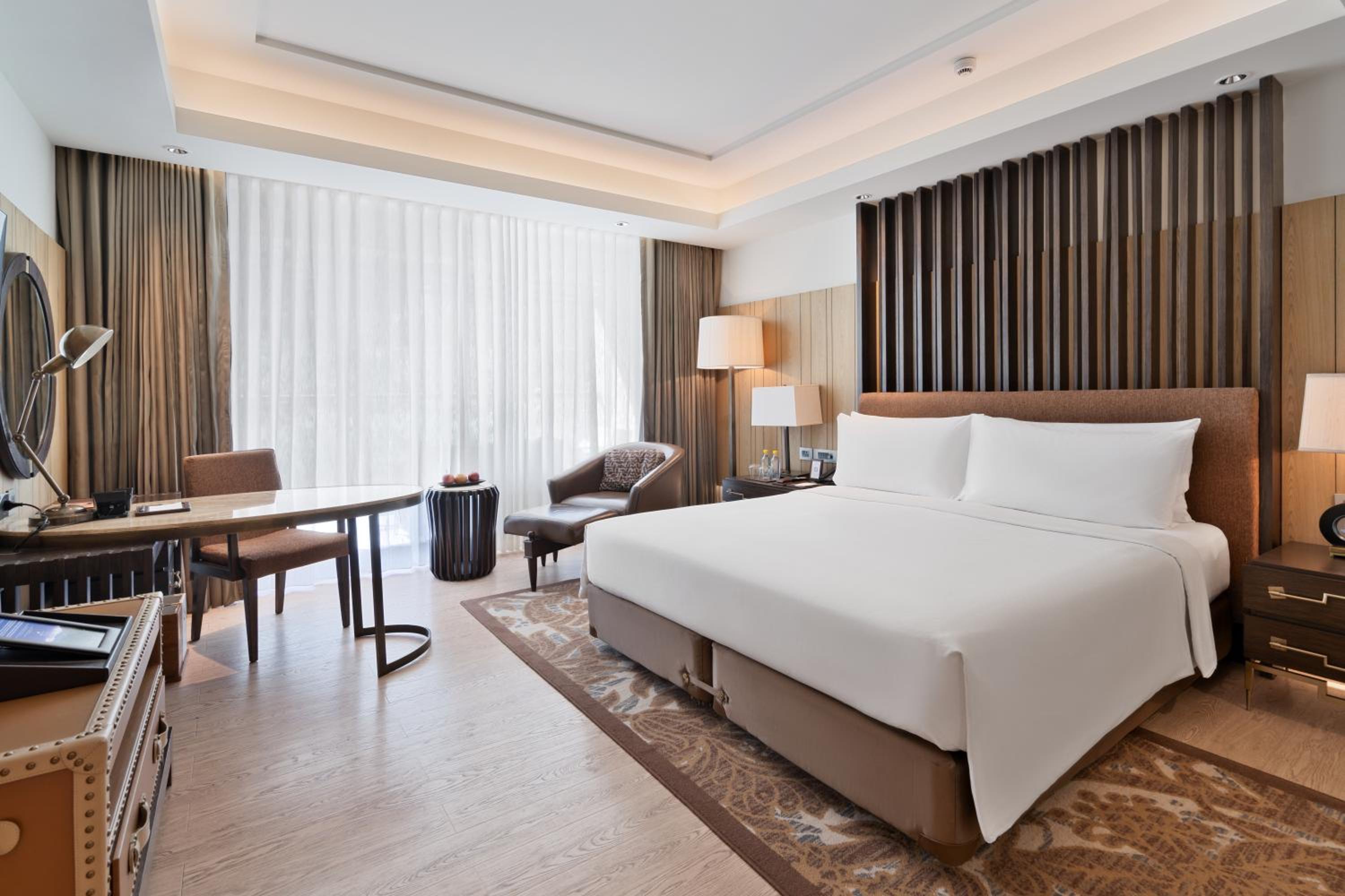 Deluxe King Balcony Room with Bathtub - Enjoy INR 1,000 Signature Resort Credit per stay photo 1