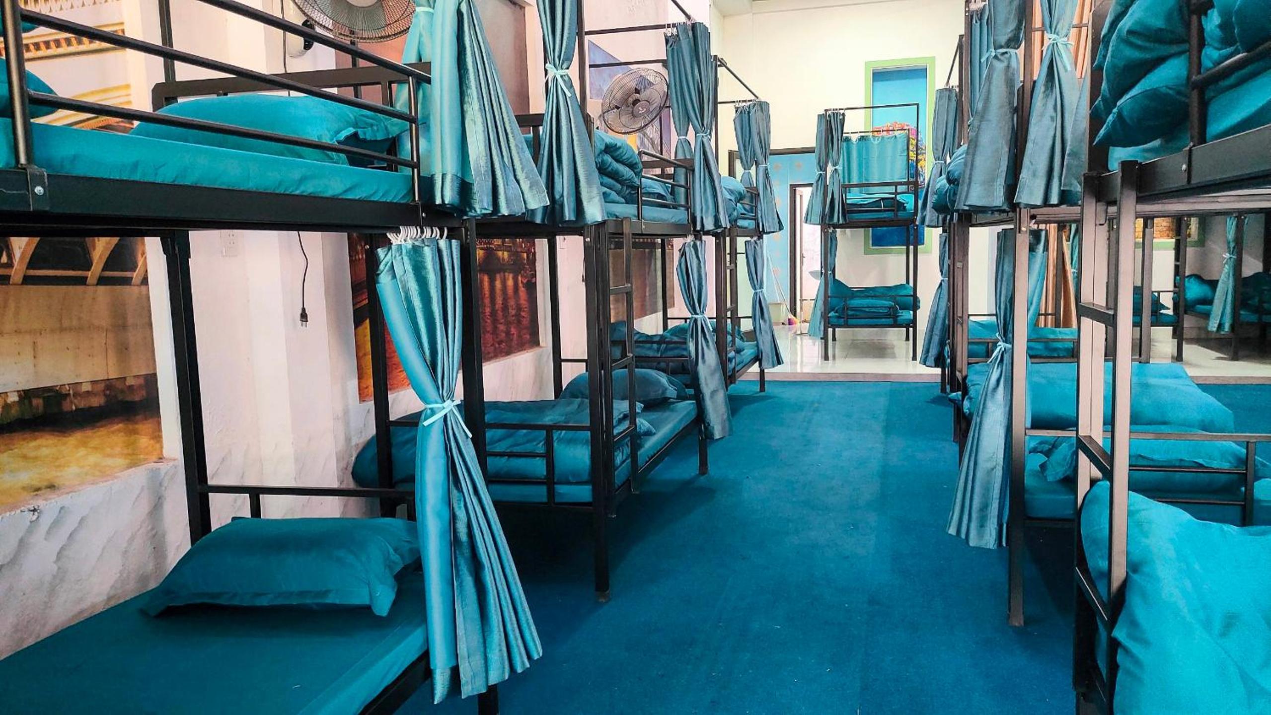Single Bed In Male Dormitory Room With Shared Bathroom