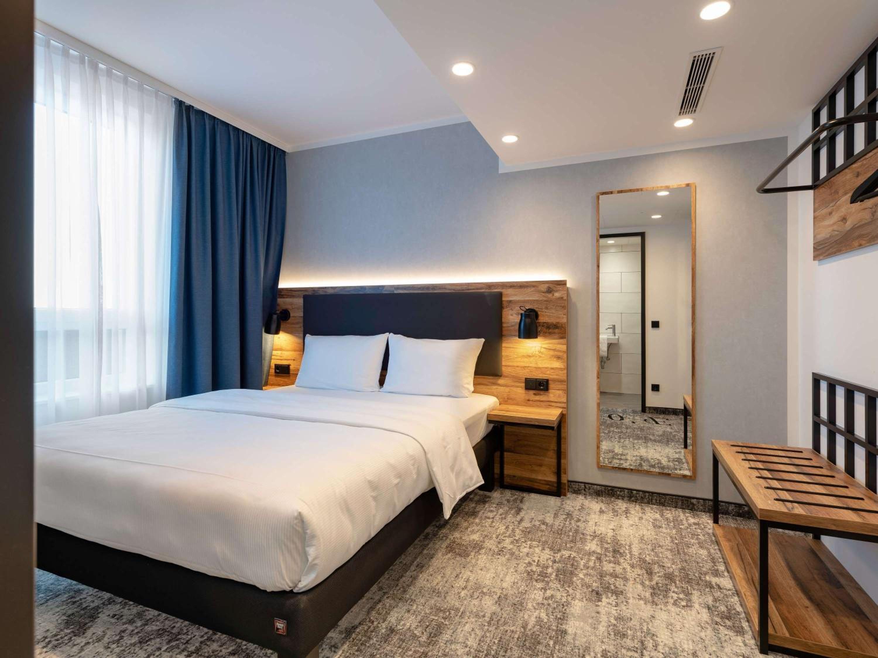Modern Family Room with One Double Bed and One Sofa - Photo 1