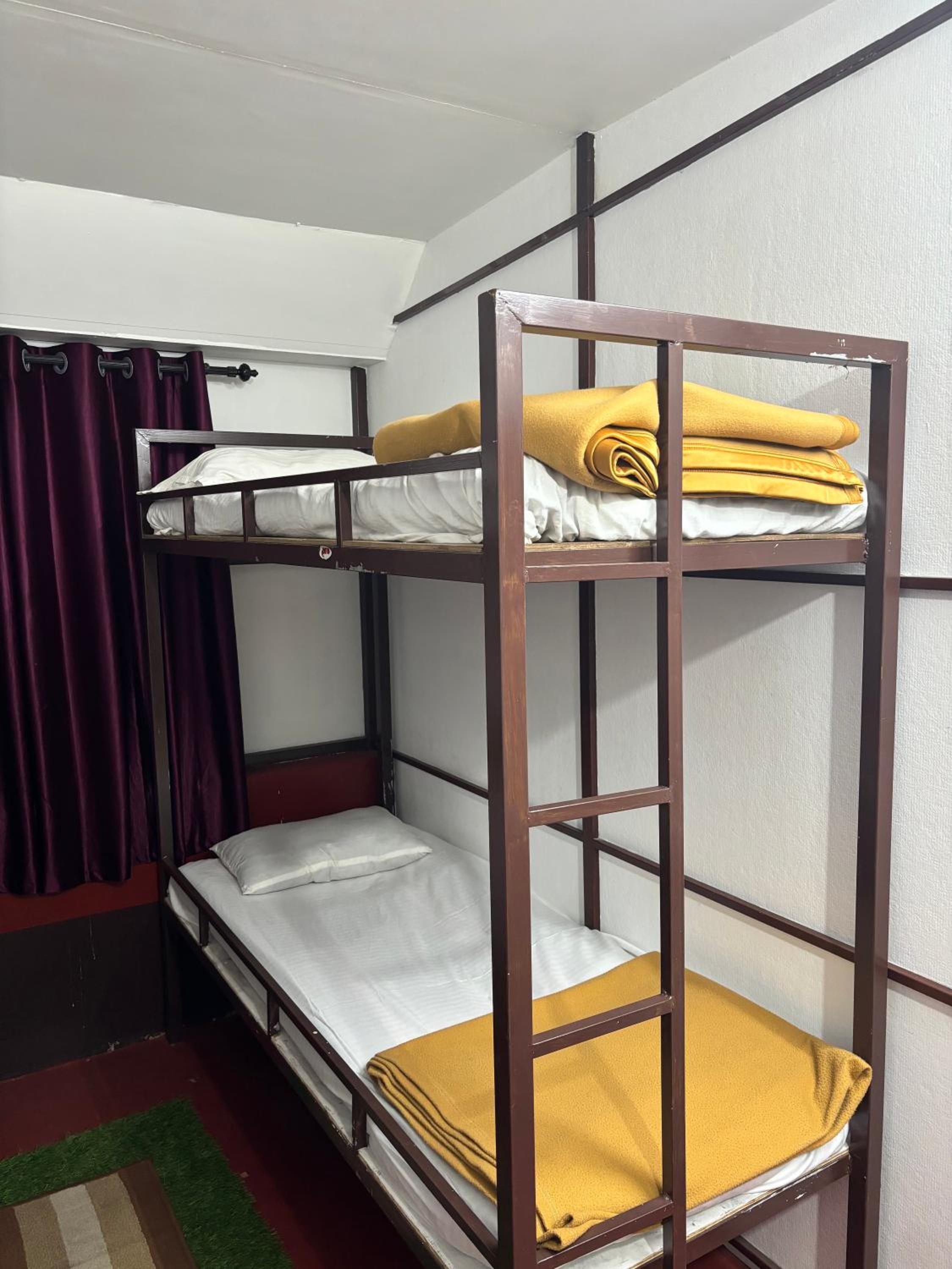 Single Bed in Dormitory Room