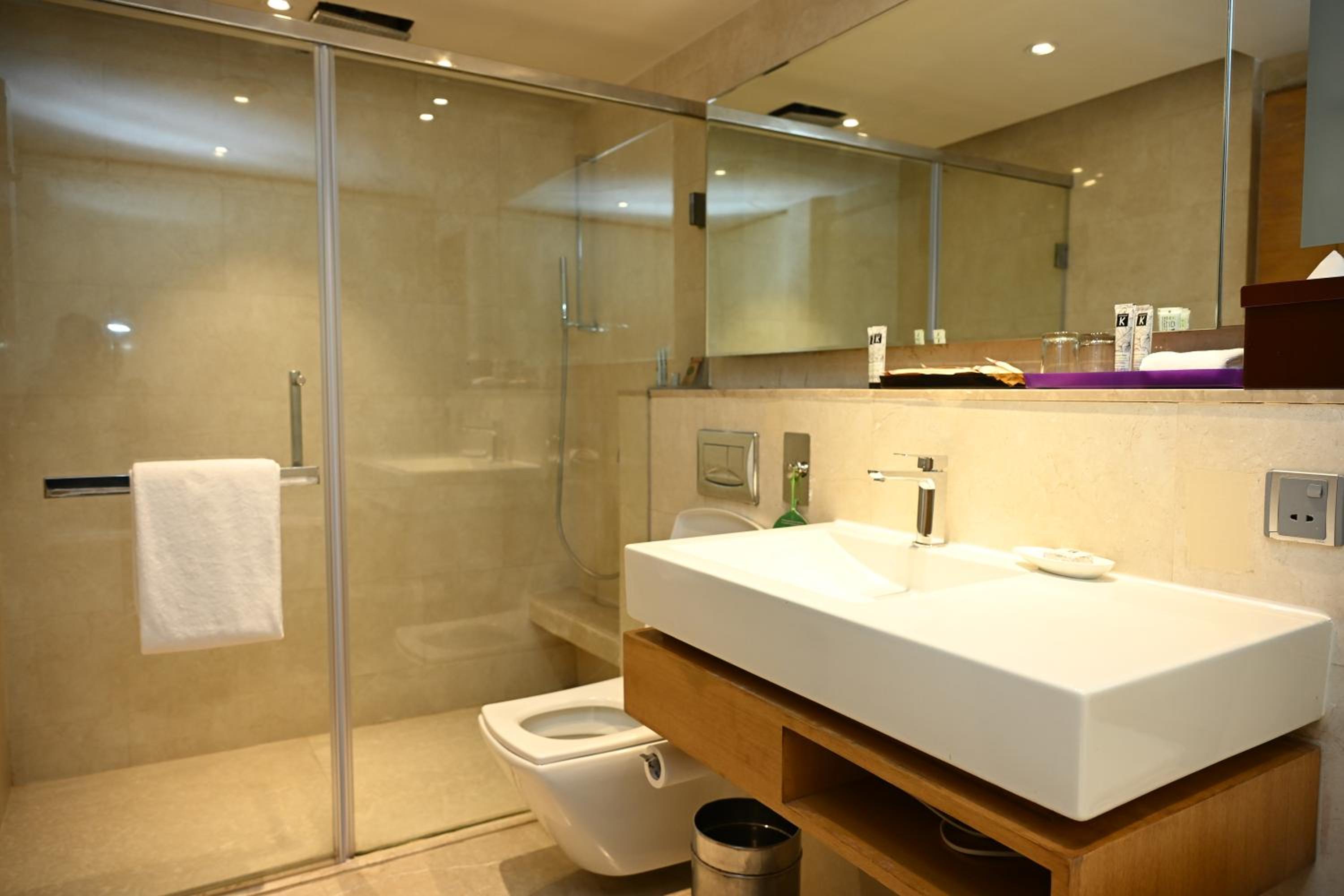 The Lalit Package - Complimentary one way airport pickup, Free 1 pint of beer at 24/7 BAR with free 2 pieces of laundry and 10% discount on Food & Soft beverages, spa n salon