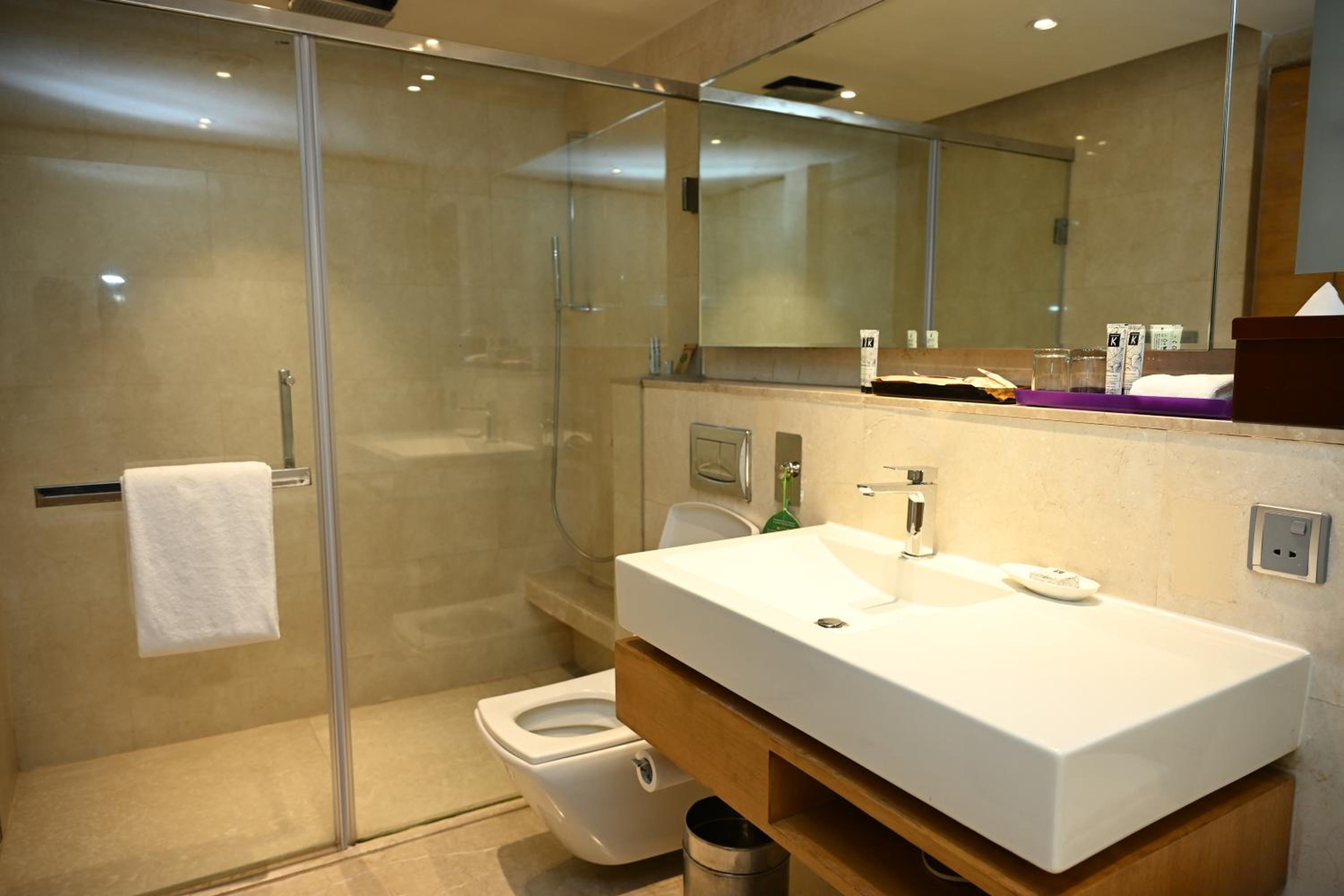 The Lalit Package - Complimentary one way airport pickup, Free 1 pint of beer at 24/7 BAR with free 2 pieces of laundry and 10% discount on Food & Soft beverages, spa n salon