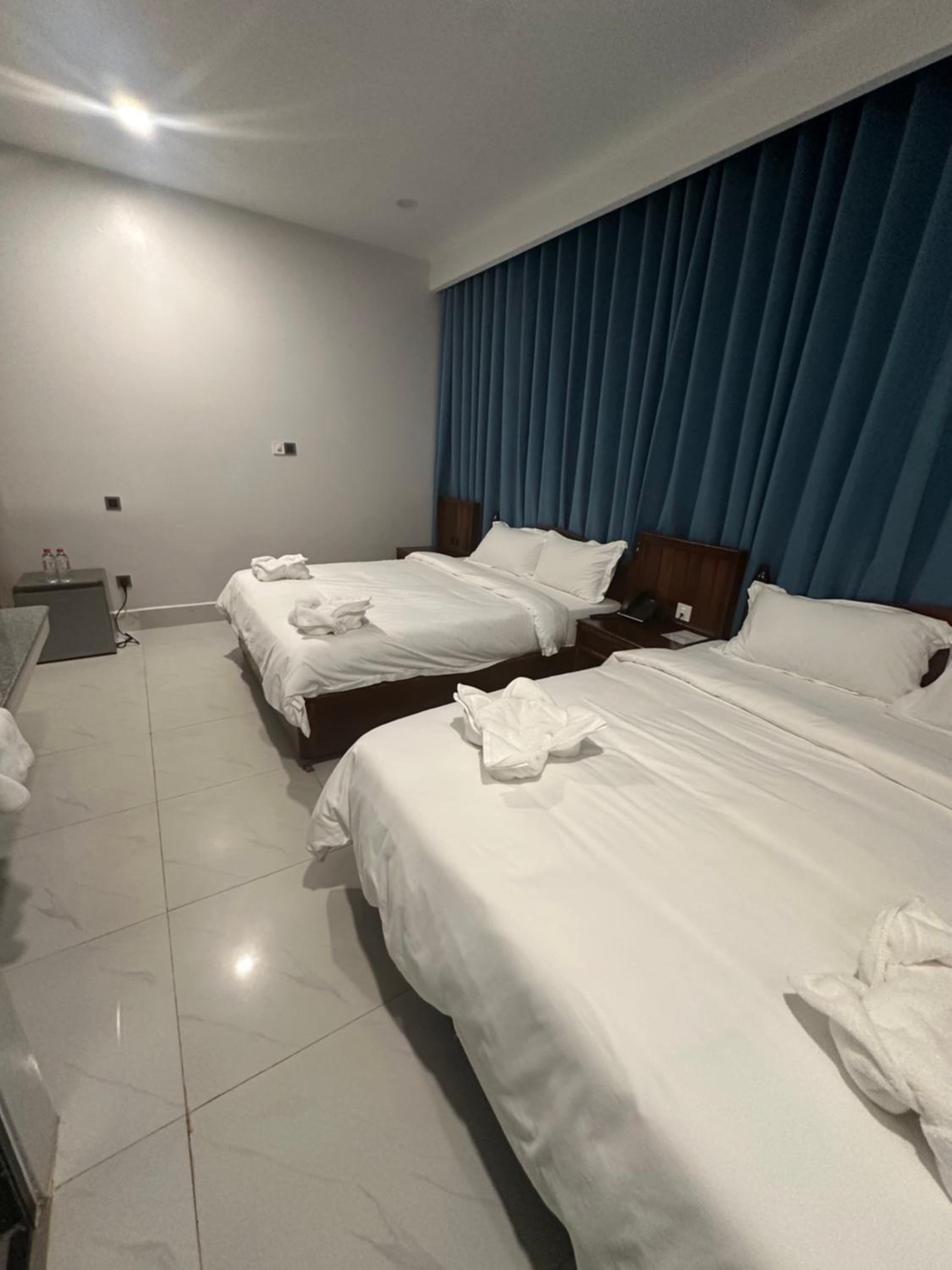 Deluxe Queen Room with Two Queen Beds - Photo 1