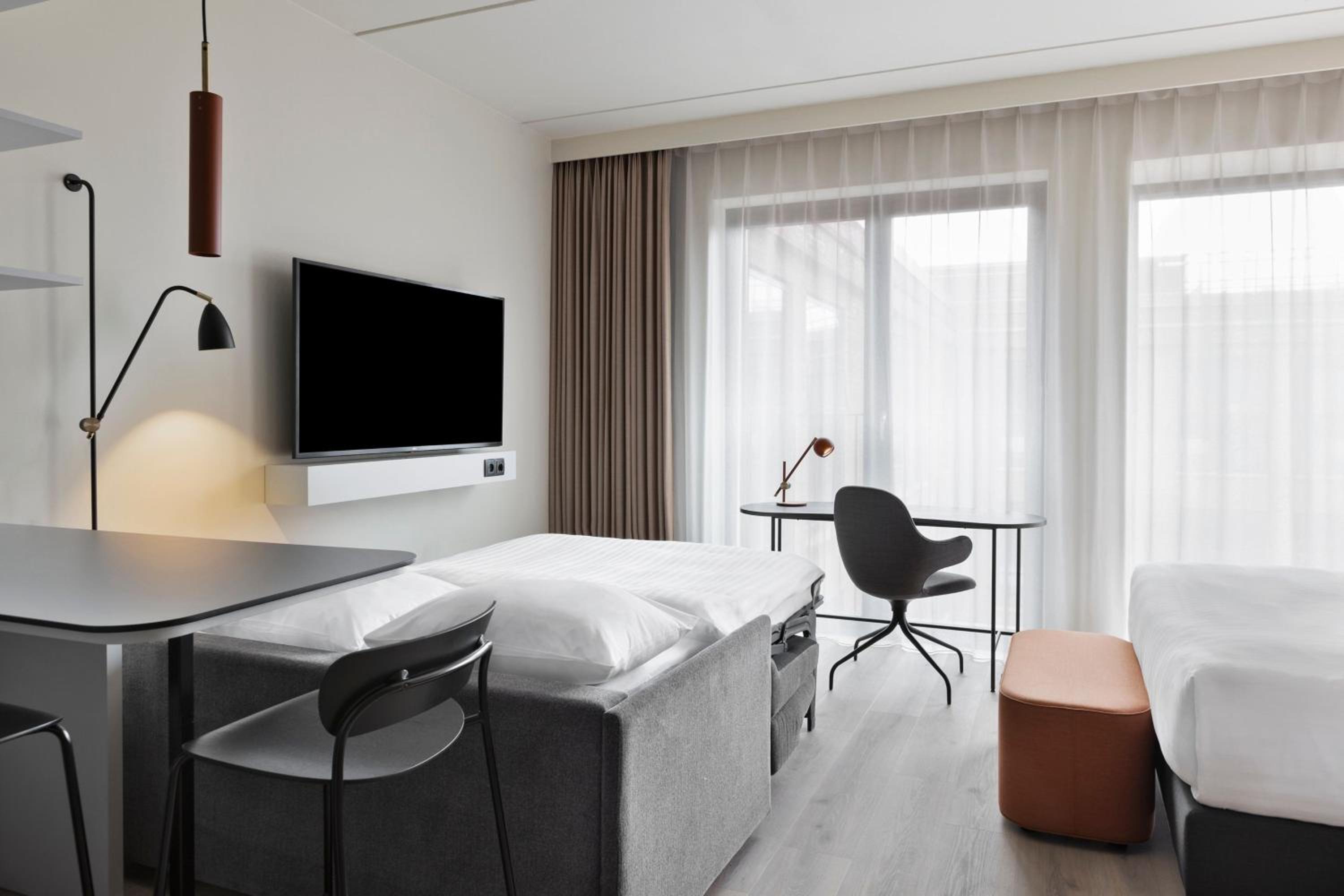Family Studio with Sofa Bed and Courtyard View - Photo 2