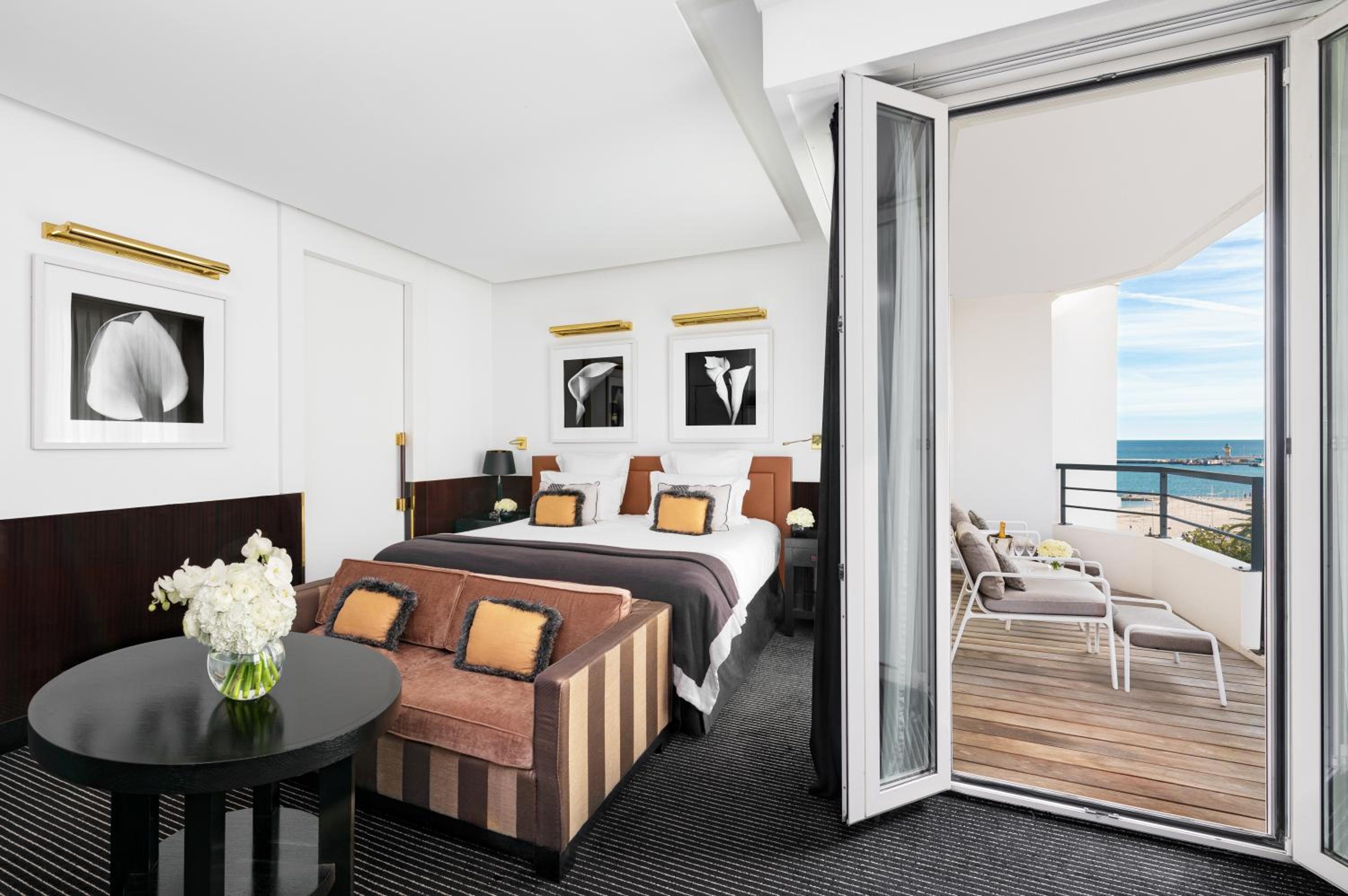 hotel room with a view of the beach and ocean
