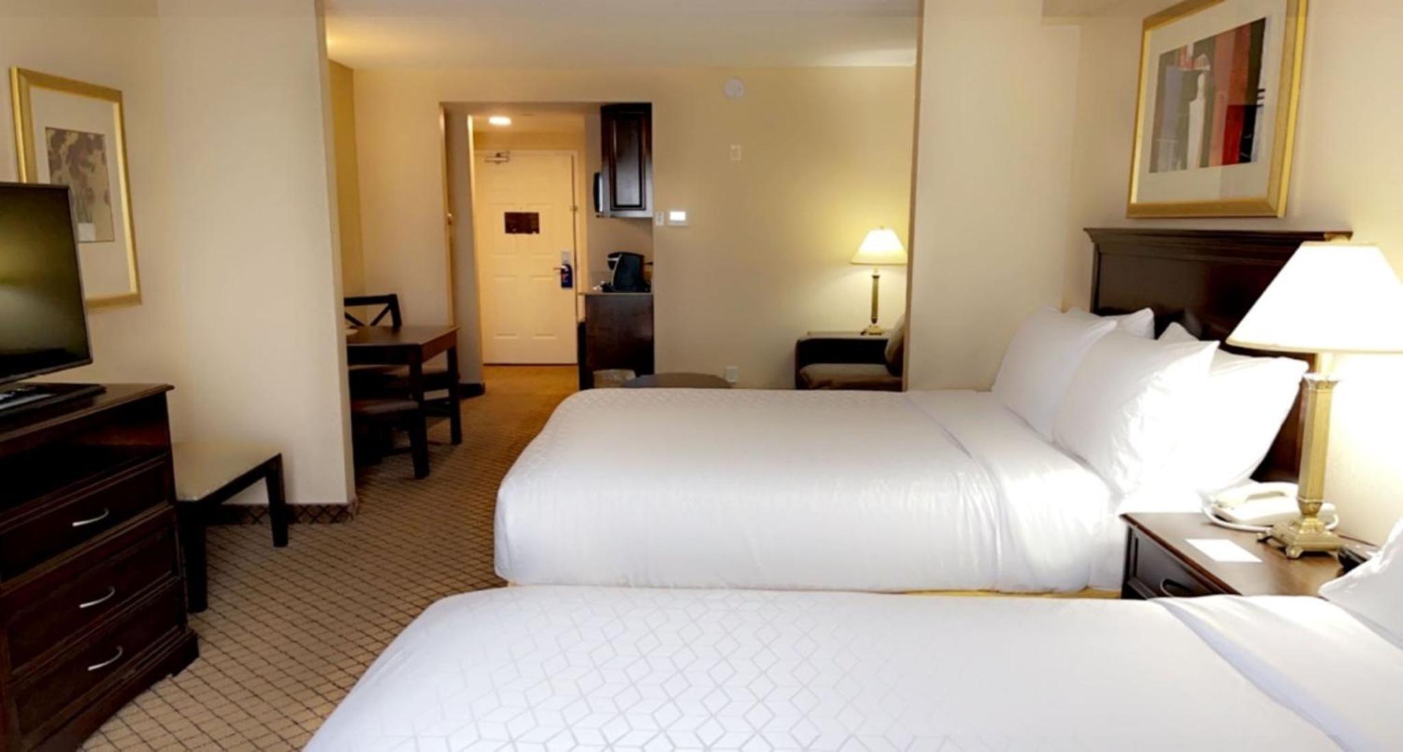 Queen Suite with Two Queen Beds and Sofa Bed - Photo 1