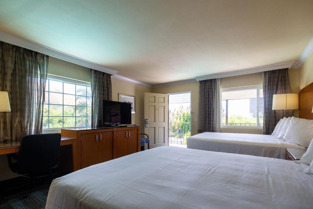 Queen Room with Two Queen Beds - Photo 1