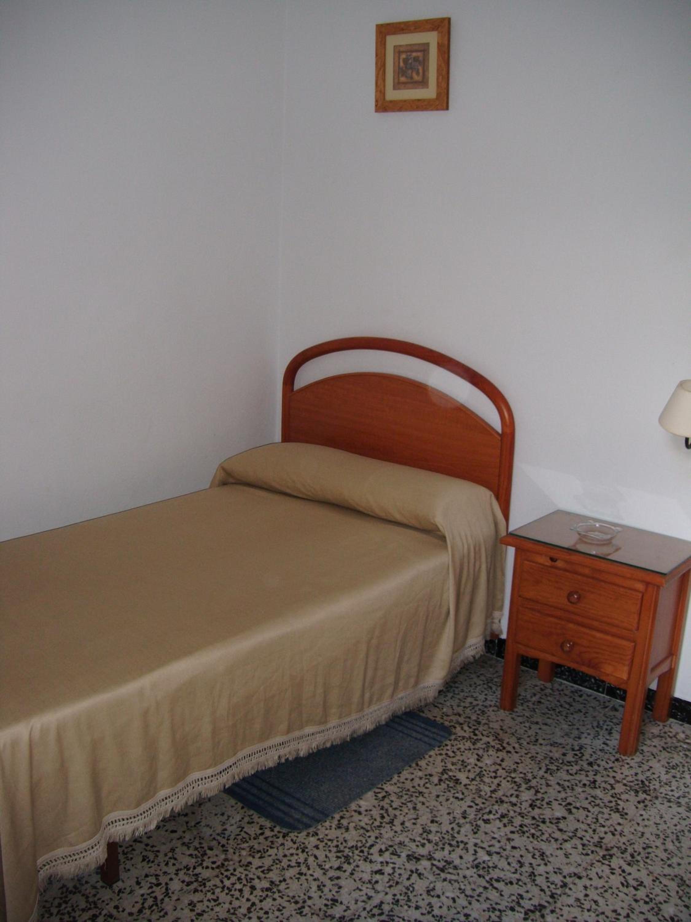 Habitación individual con baño compartido