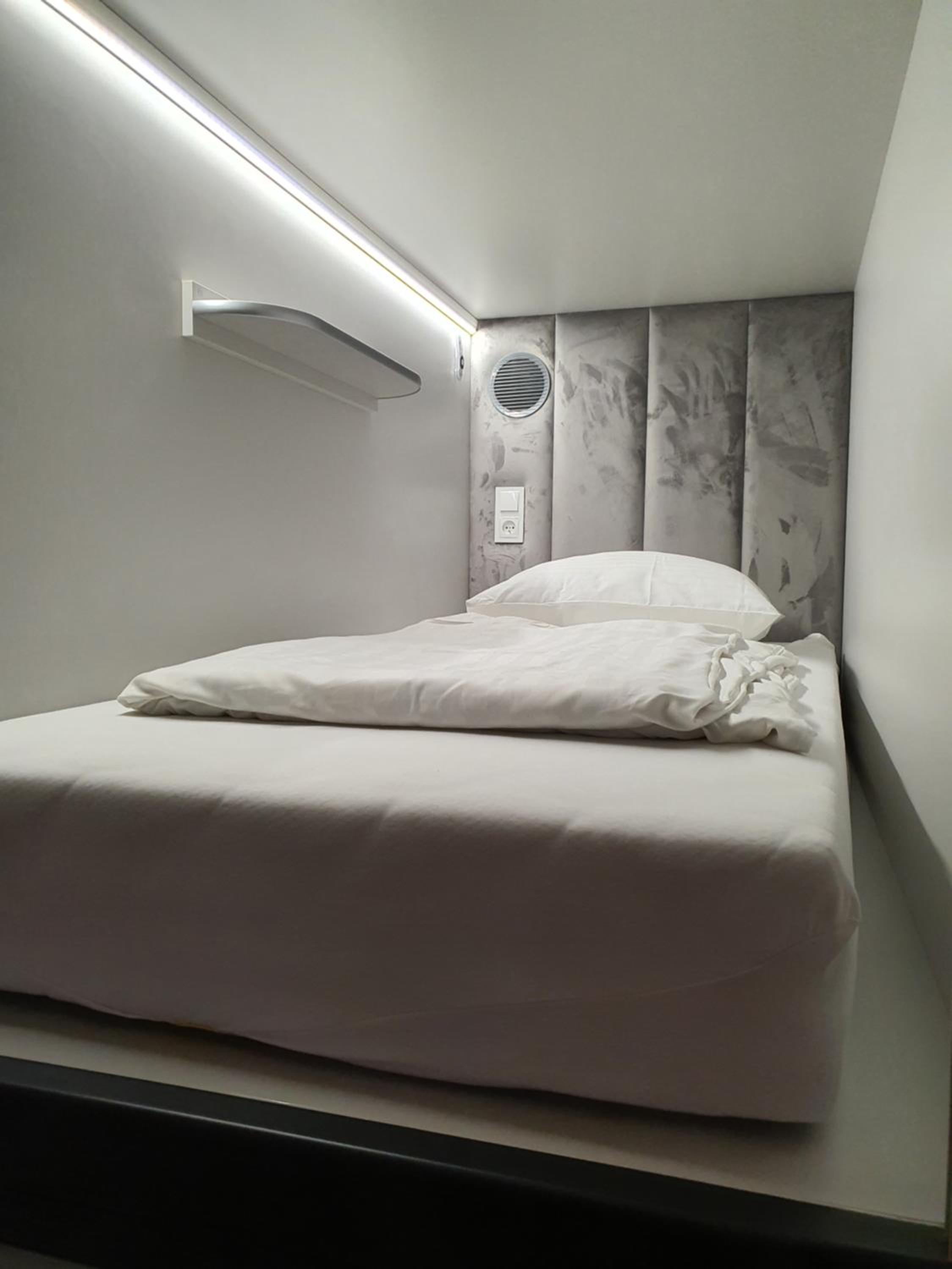 Single Capsule in a room with other capsules photo 1