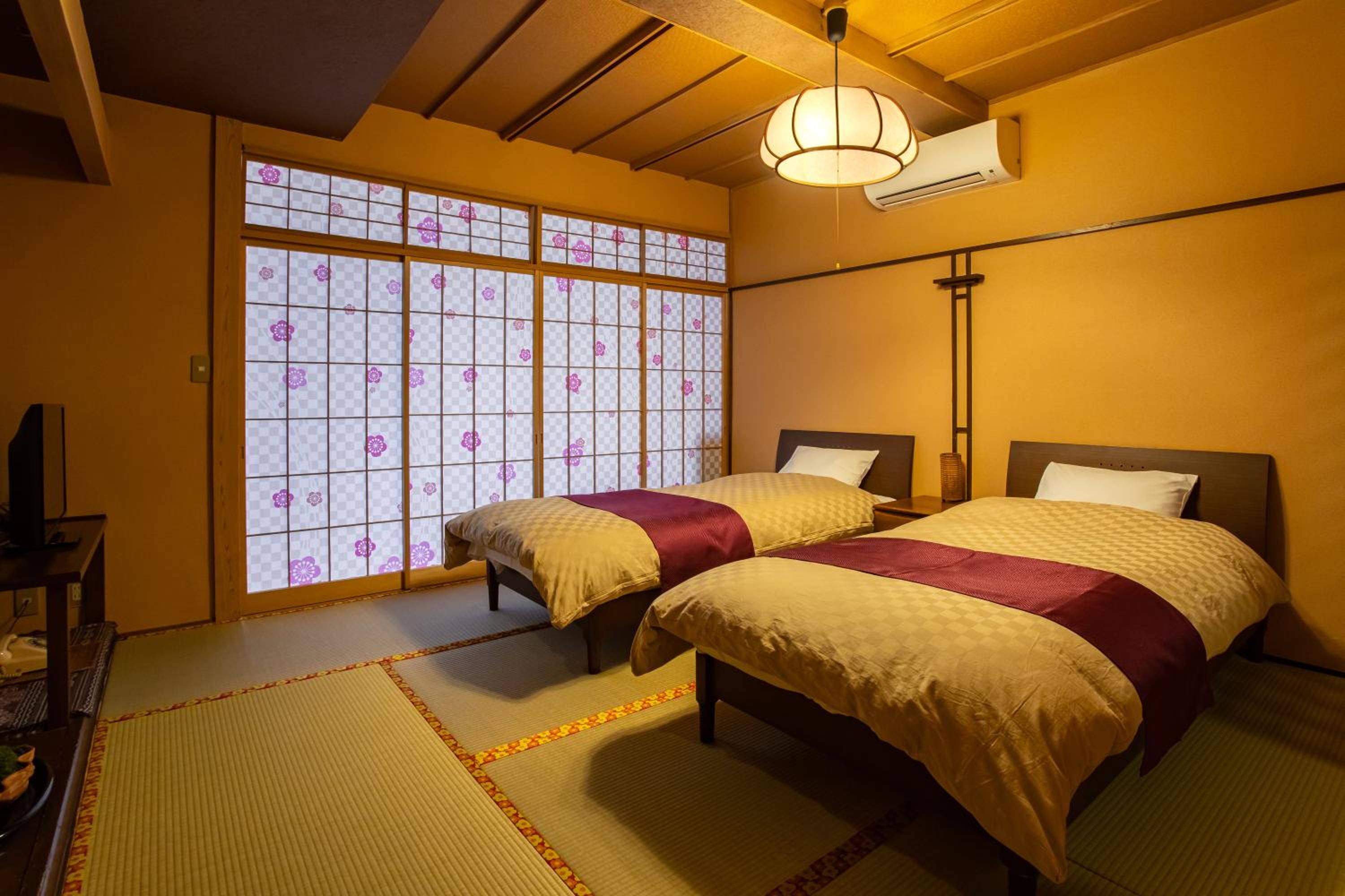 Twin Room with Private Bathroom - Photo 1