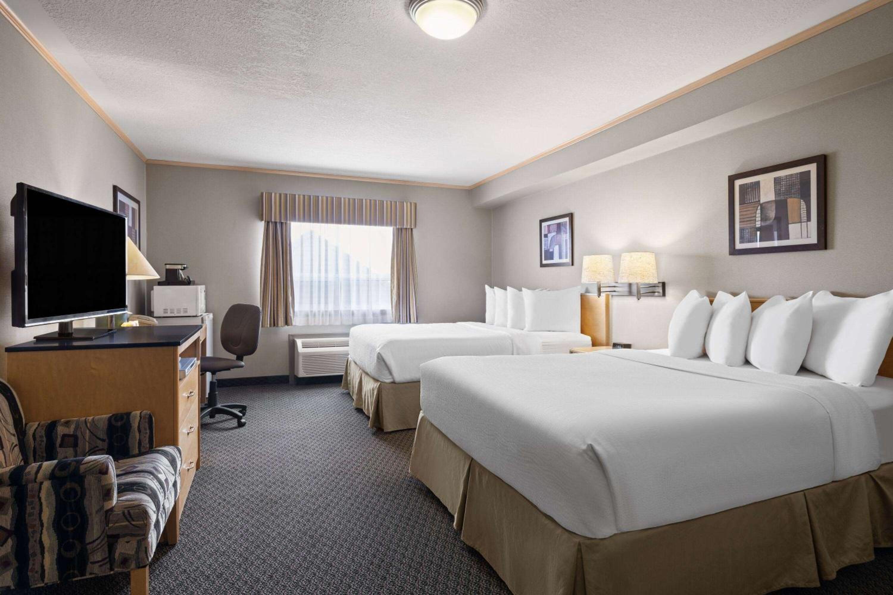 Superior Queen Room with Two Queen Beds - Smoking - Photo 1