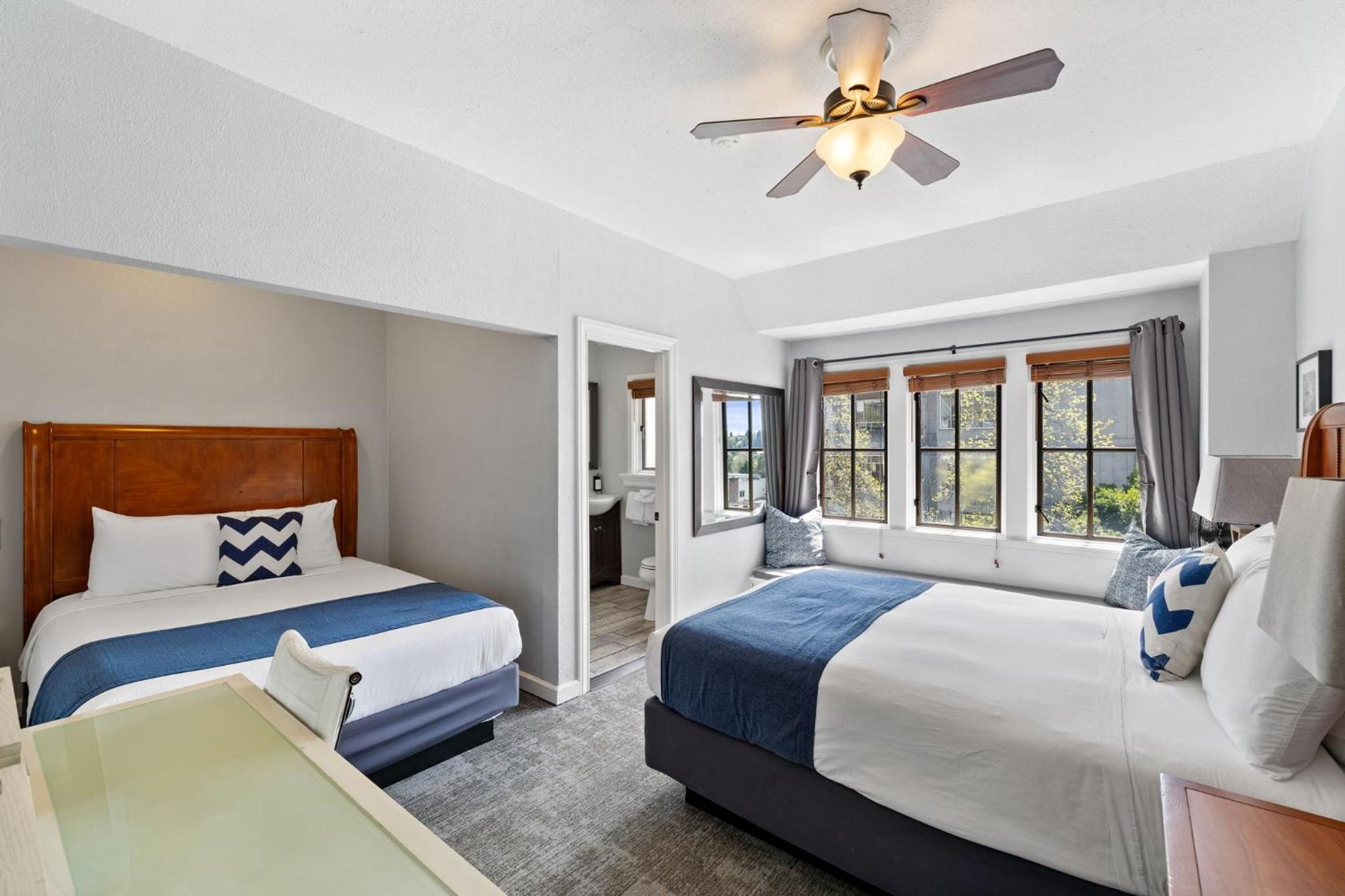 Premium Double Room - Two Queen Beds, Private Bathroom - Photo 1