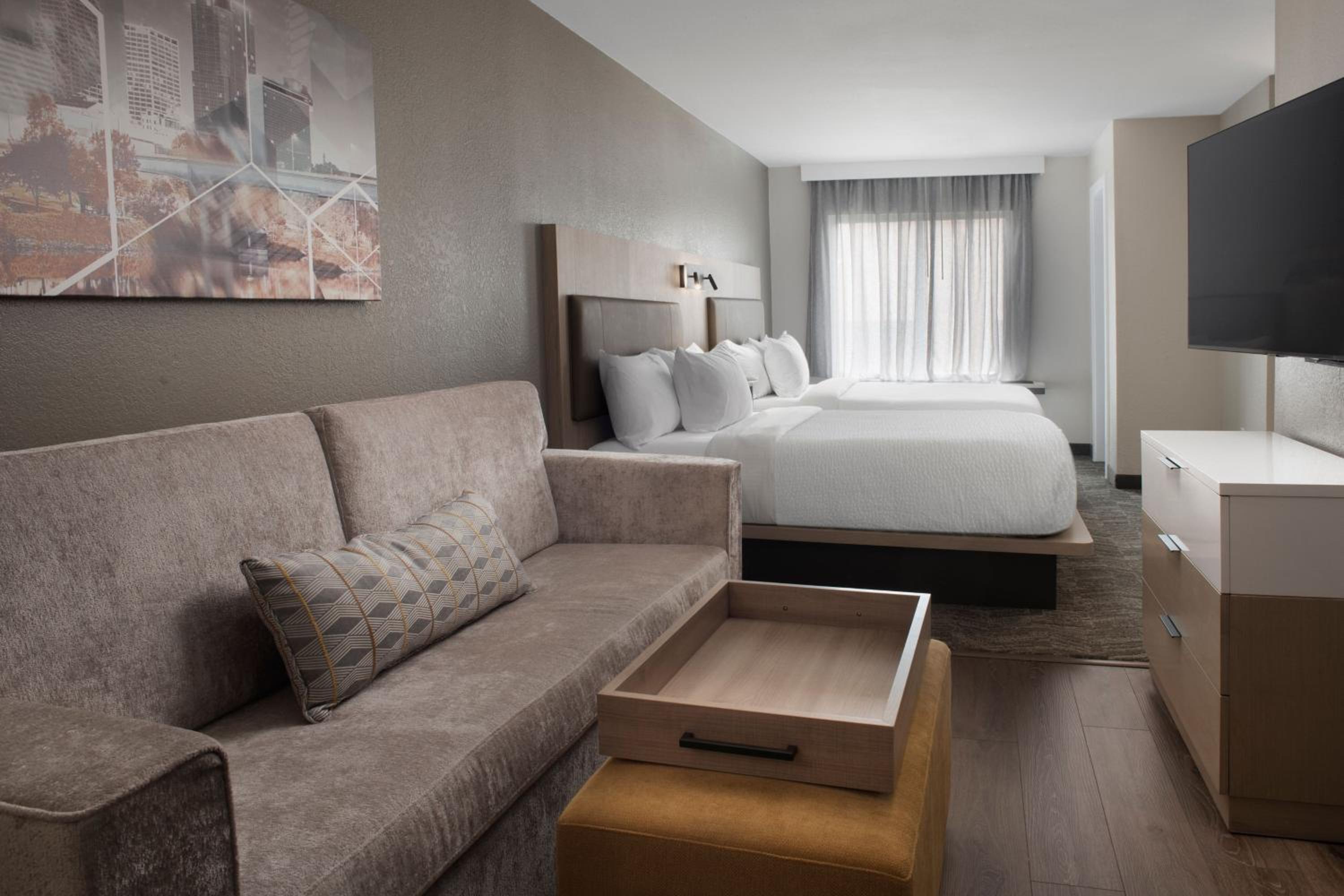 Queen Suite with Two Queen Beds and Sofa Bed - Photo 1