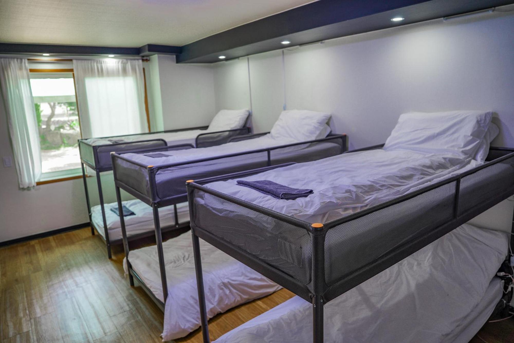 Bed in 6-Bed Male Dormitory Room - Photo 1