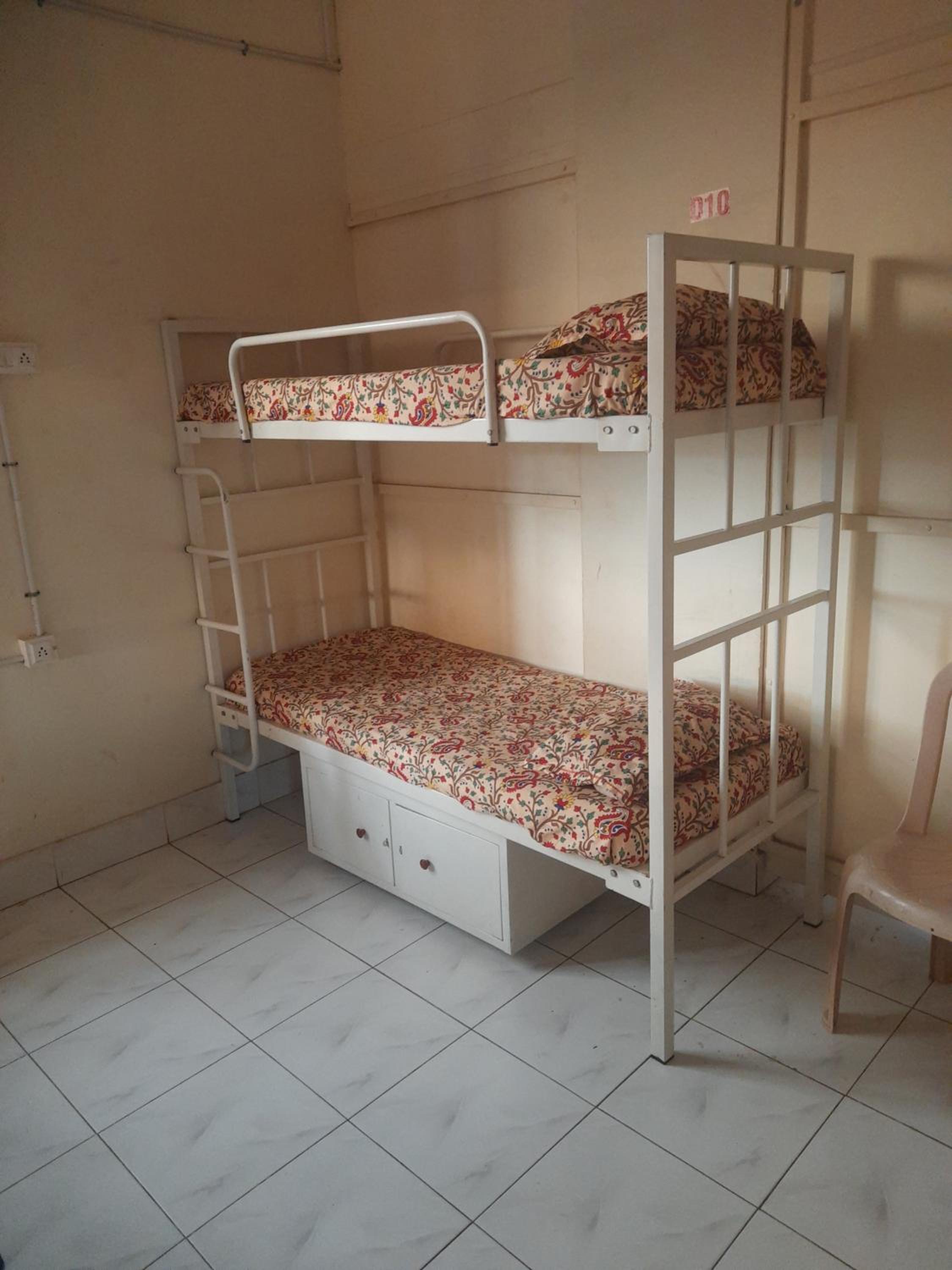 Single Bed in Male Dormitory Room photo 1