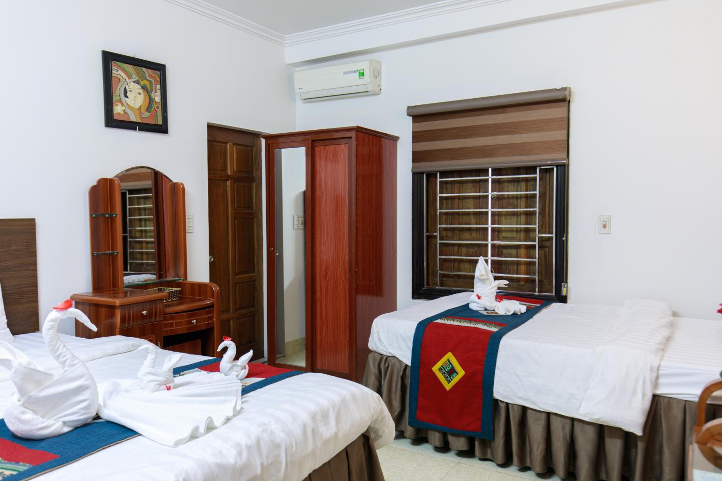 Deluxe Triple Room - Photo 9