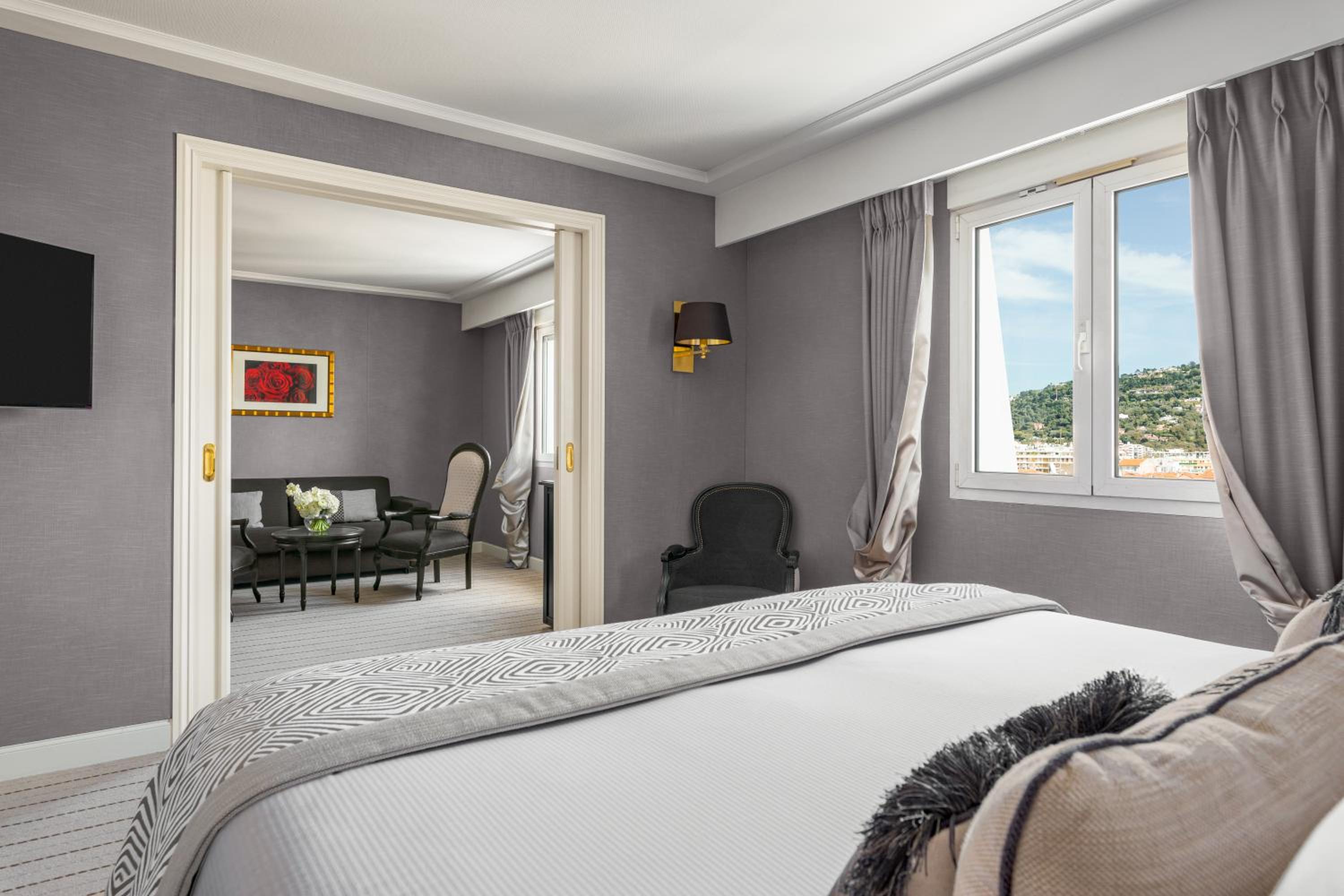 bedroom with a large bed and a flat screen tv