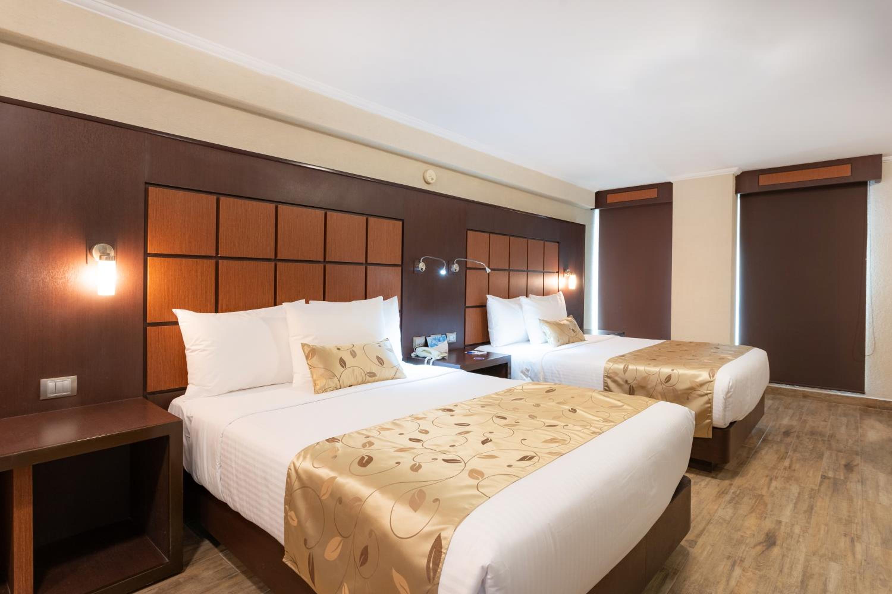 Quadruple Room with Two Queen Beds and No View - Non Smoking/Interior Hall photo 1