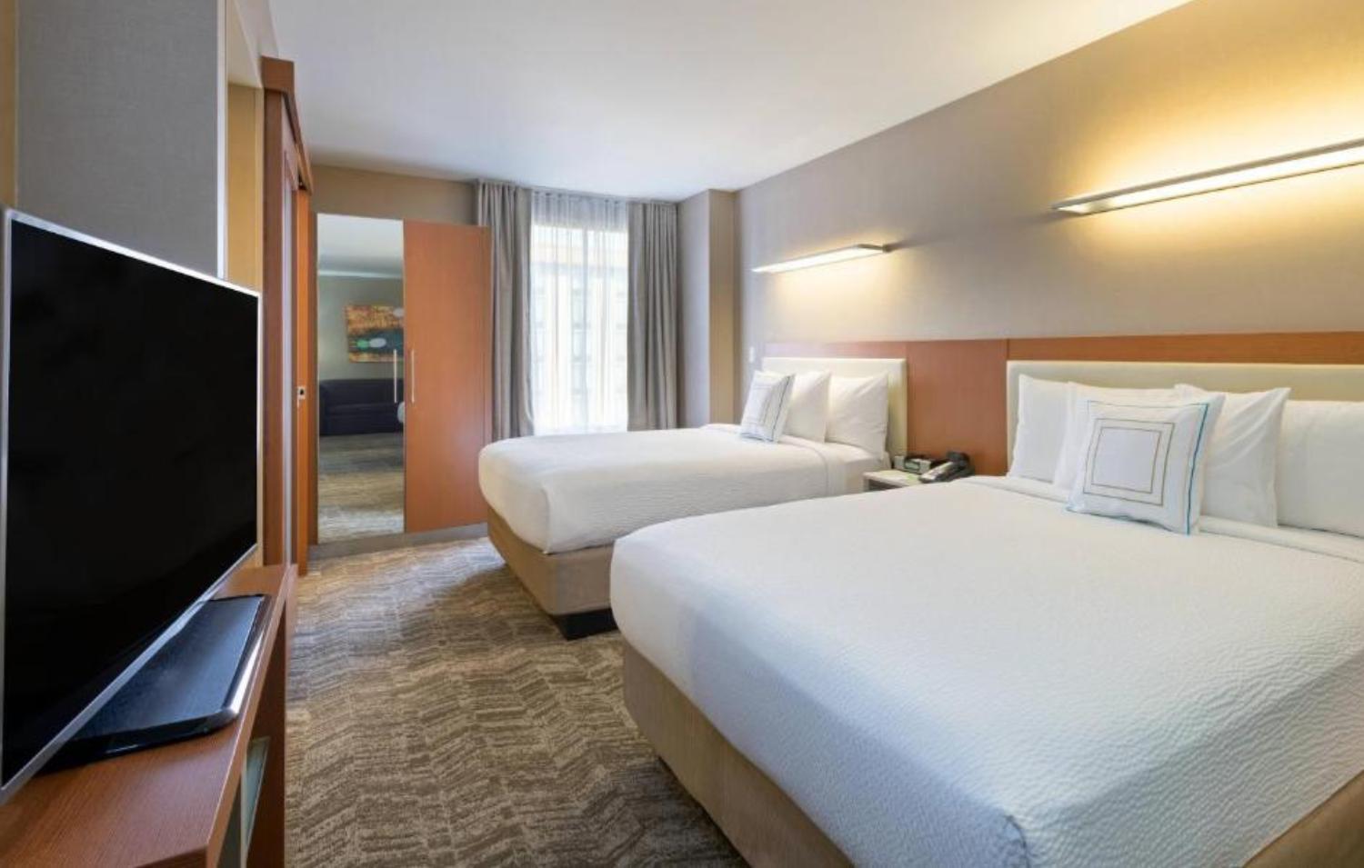 Queen Suite with Two Queen Beds and Sofa Bed - Photo 1