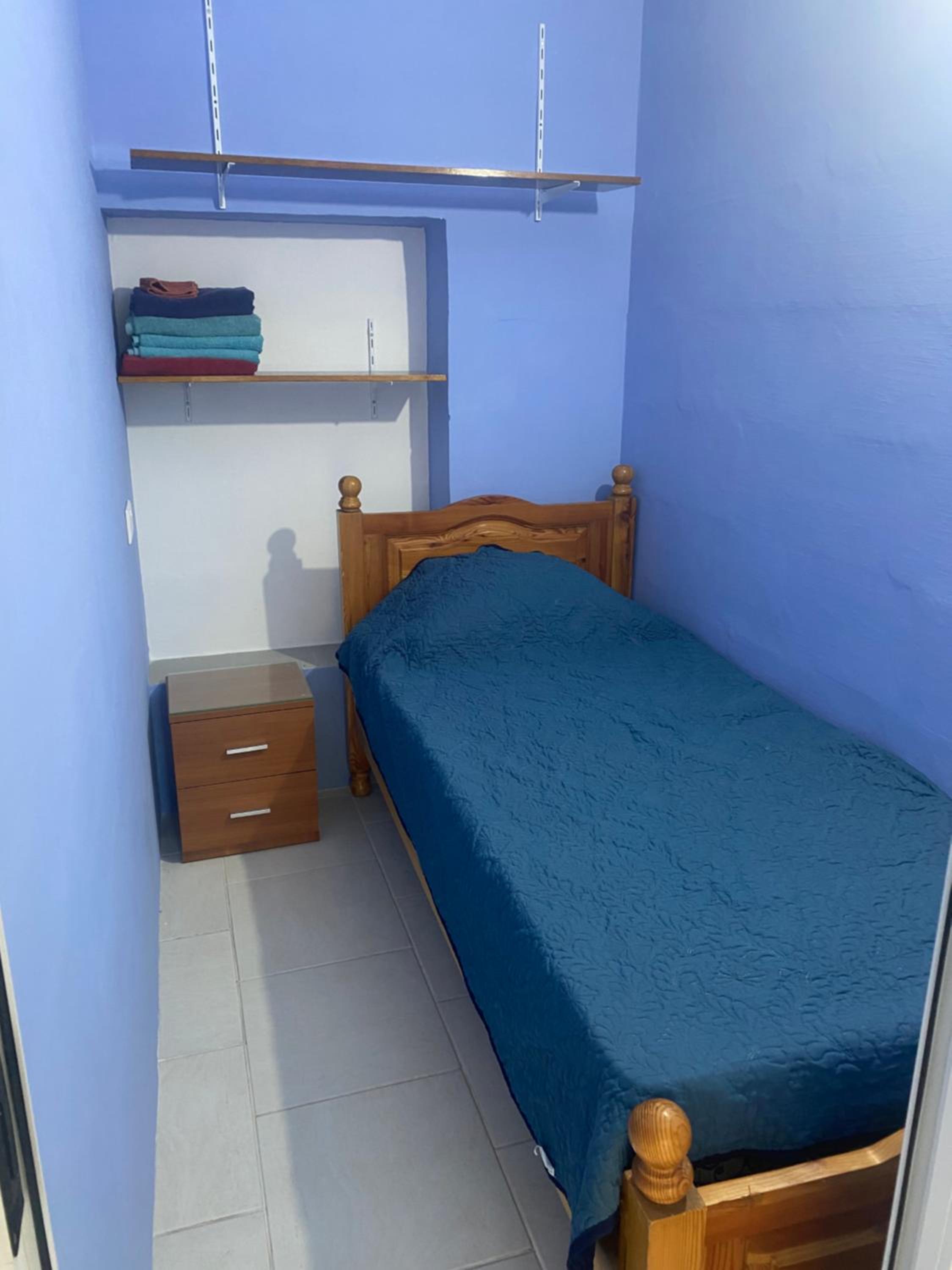 Single Bed In Dormitory Room
