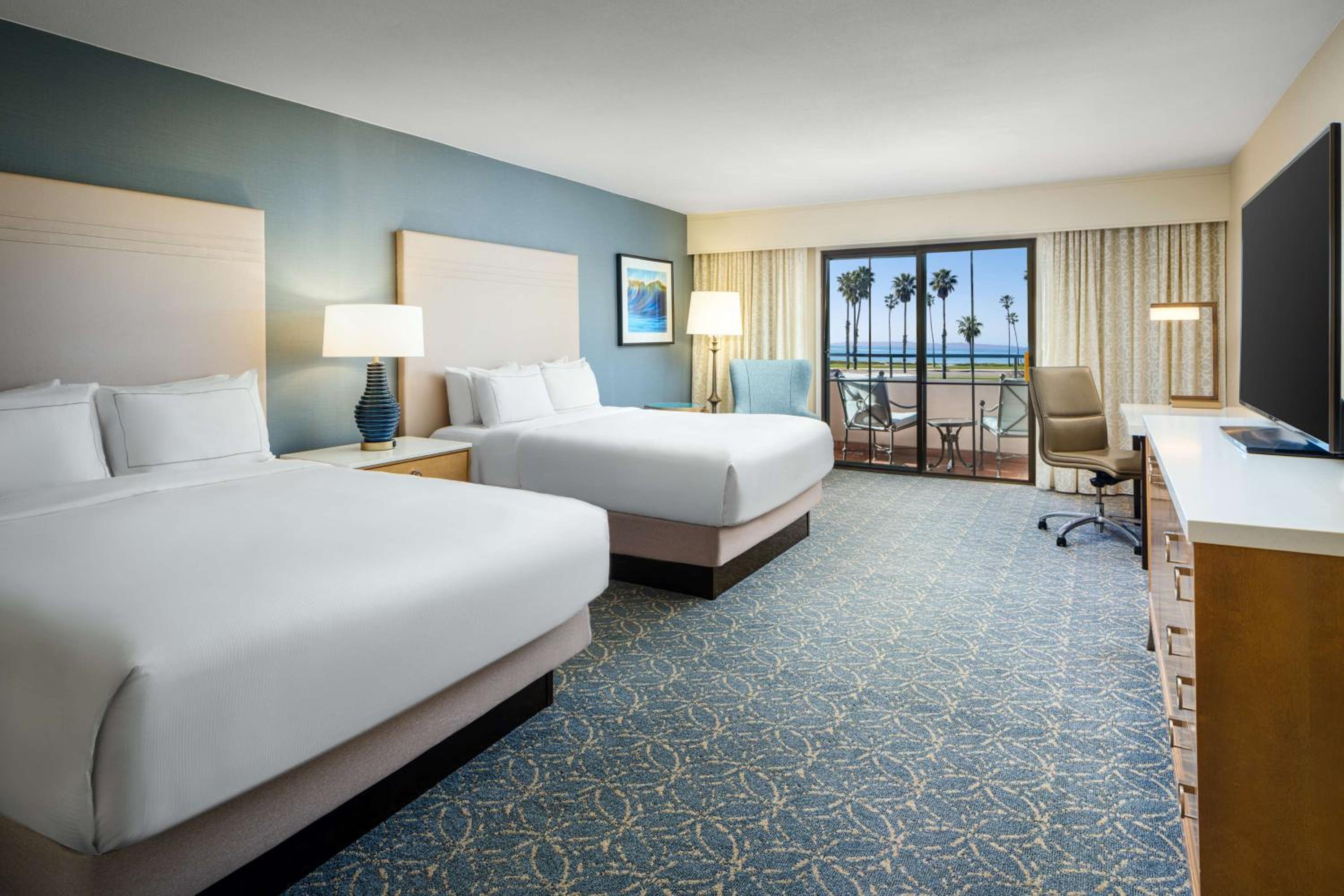 Queen Room with Two Queen Beds and Partial Ocean View - Photo 1