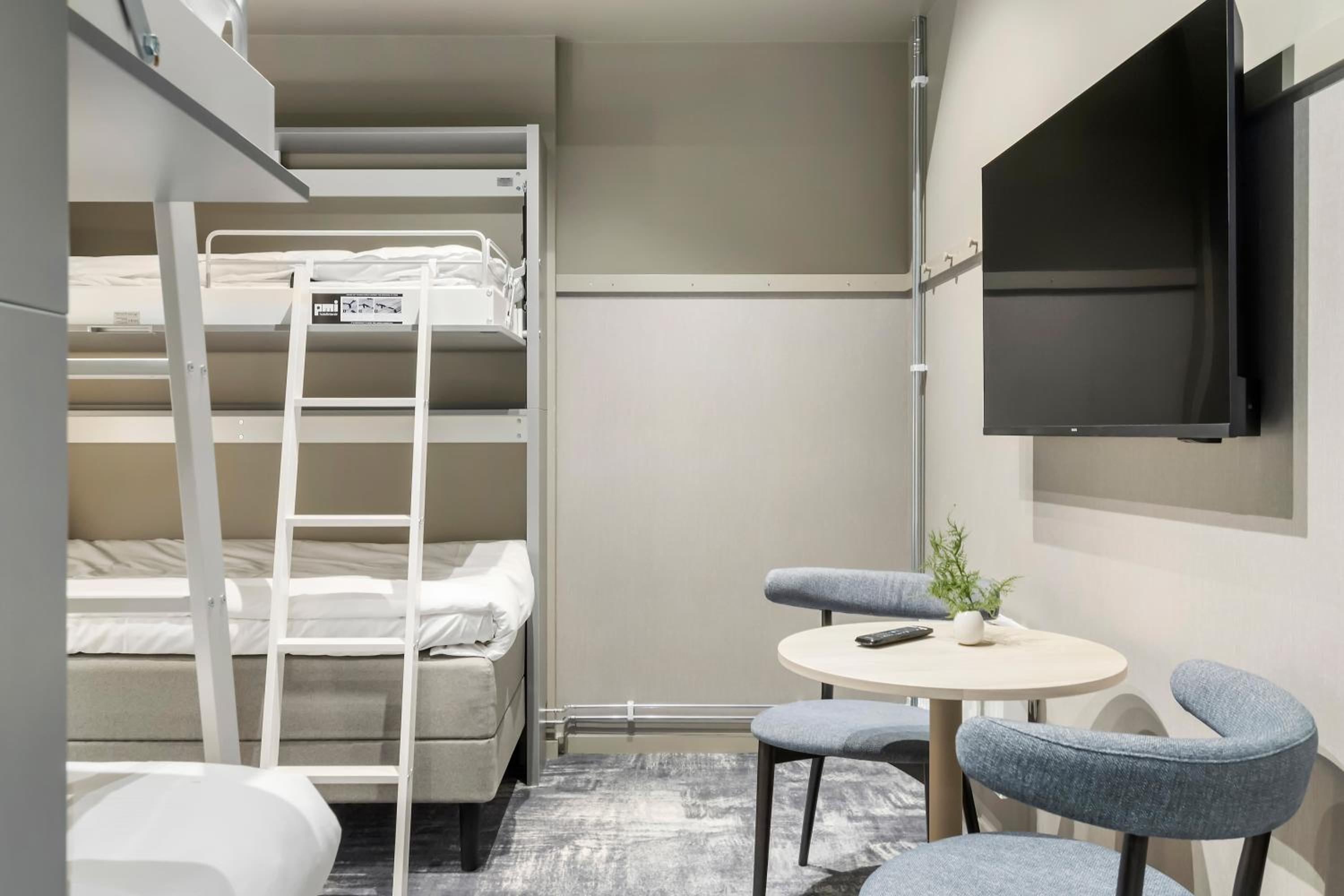 Family Room with Two Single Beds and One Bunk Bed - No Window - Photo 1
